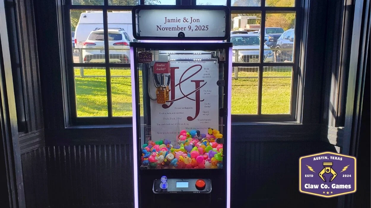 A special custom wrapping on a medium claw machine filled with rubber ducks for Jon and Jamie's wedding. (2025)