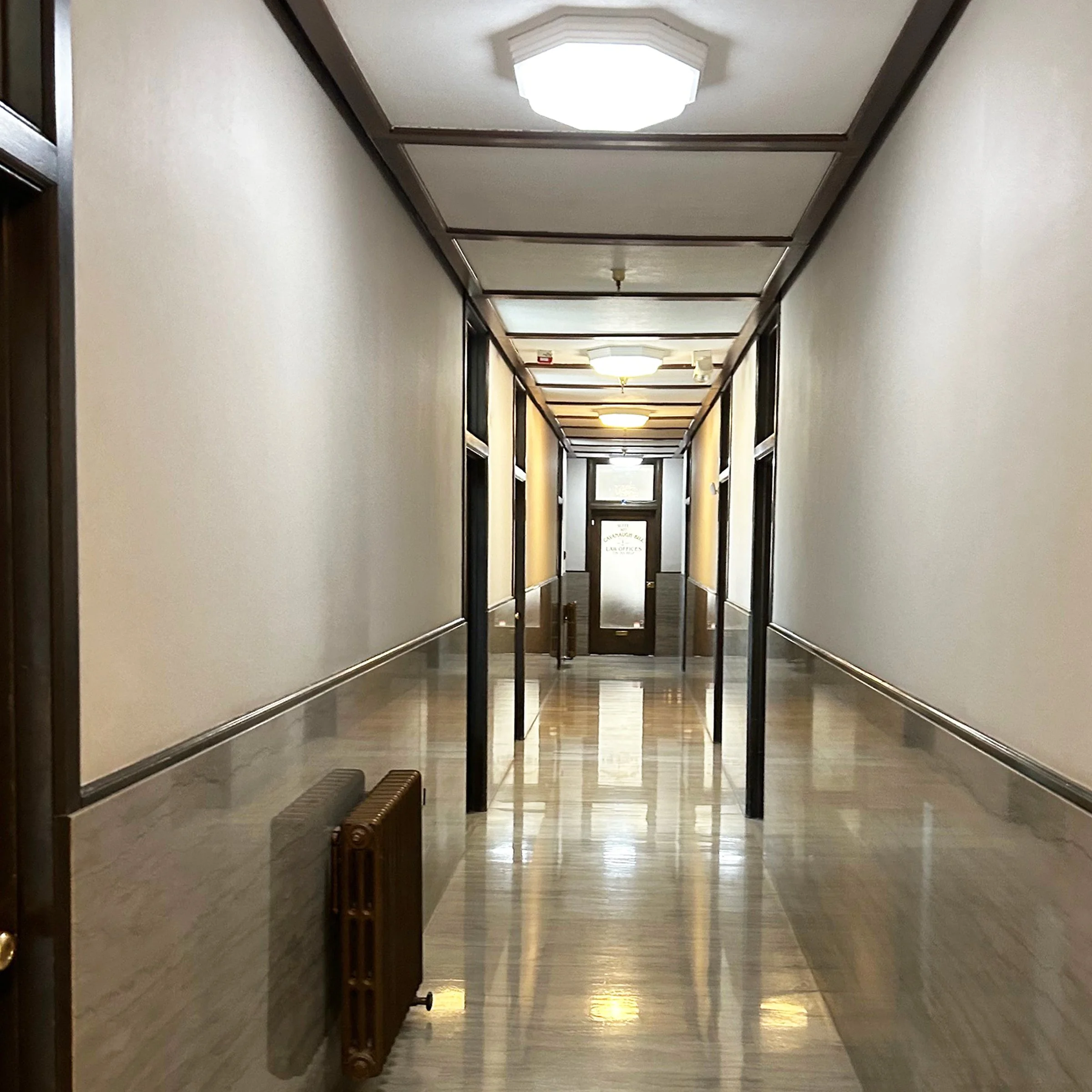 Corridors are lined with white marble wainscoting. 