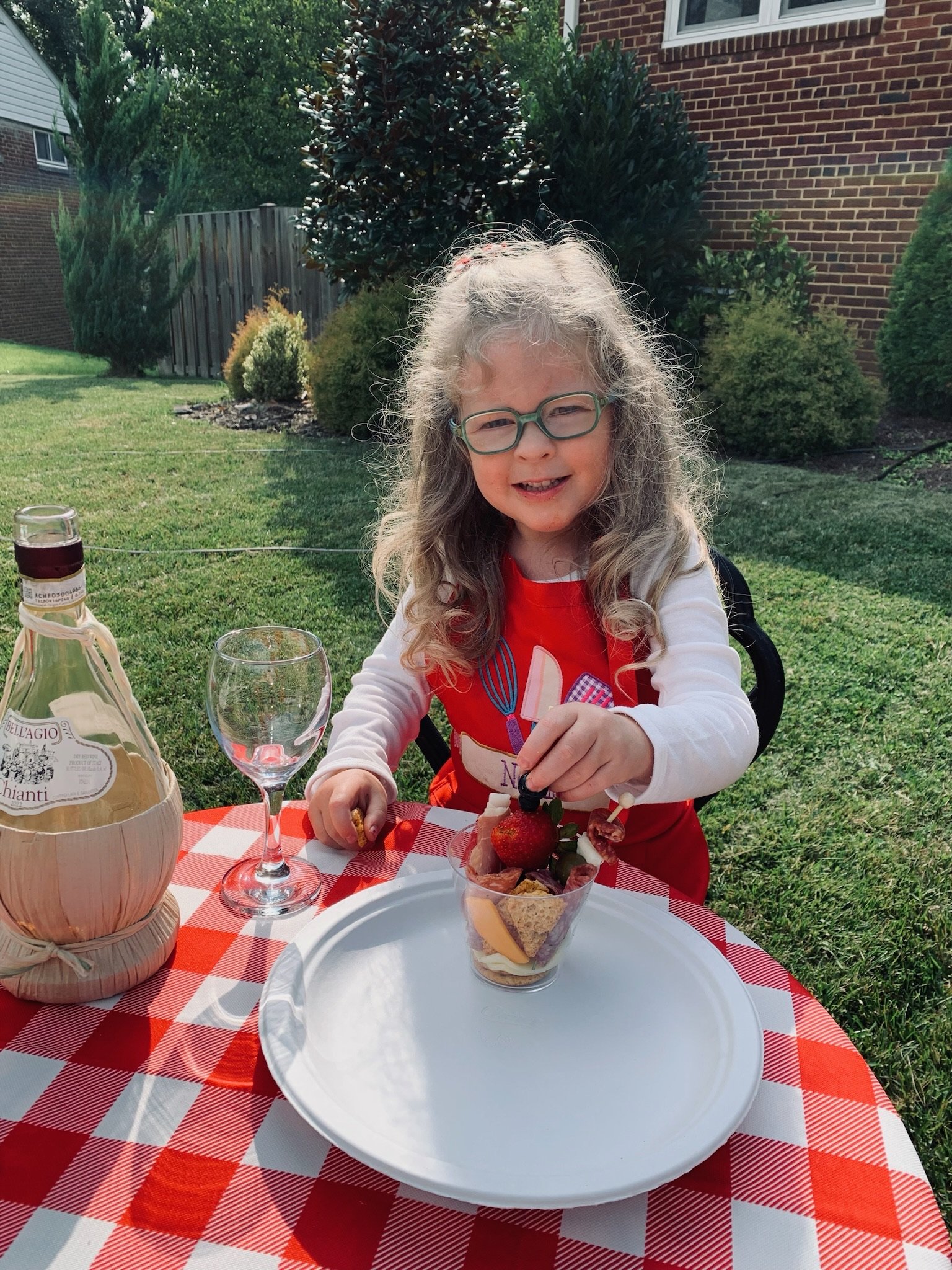Cutest little helper at Lucca's Pizza birthday party