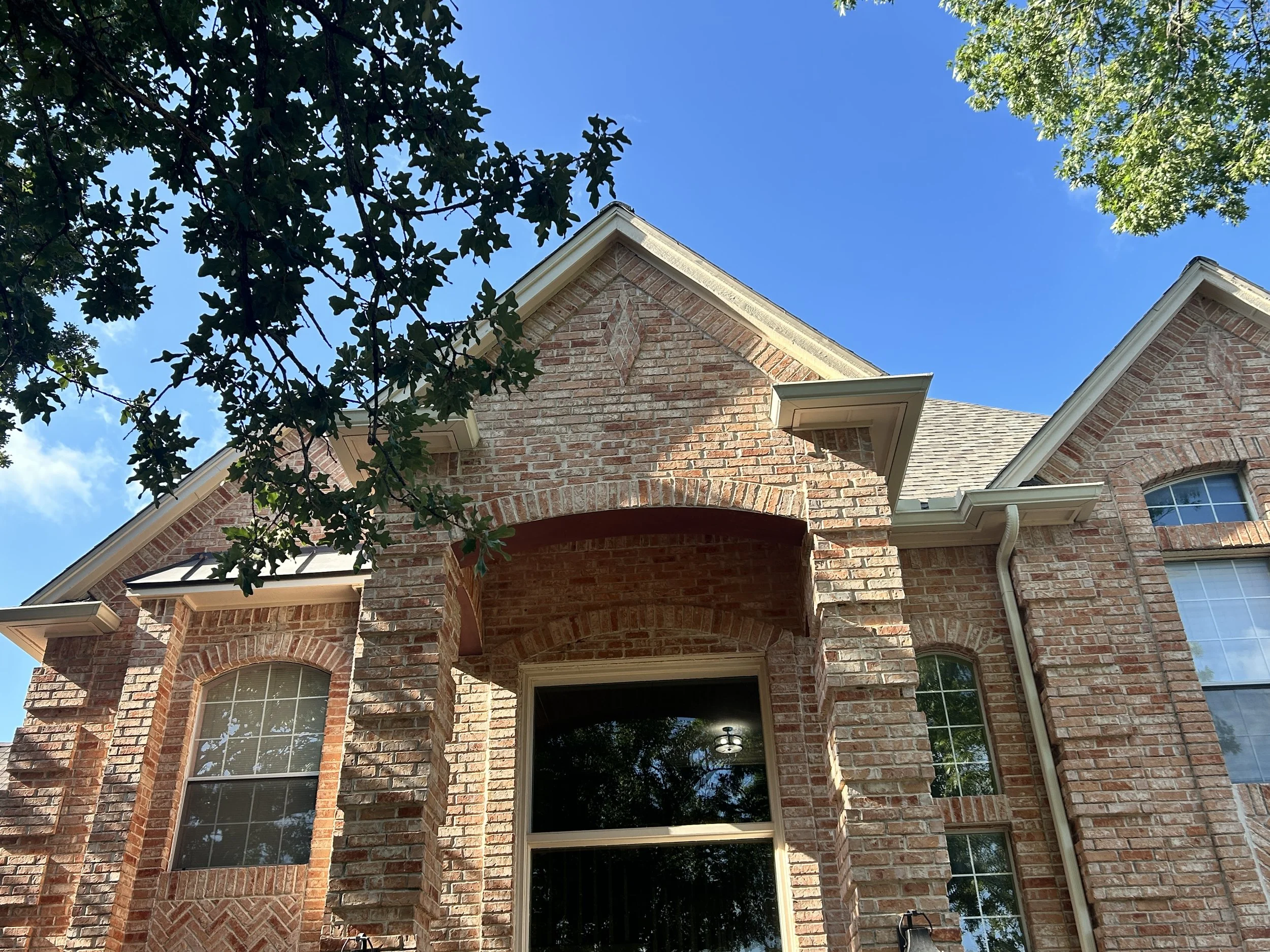 Triple brick archway reconstruction with structural steel support and rebuilt masonry