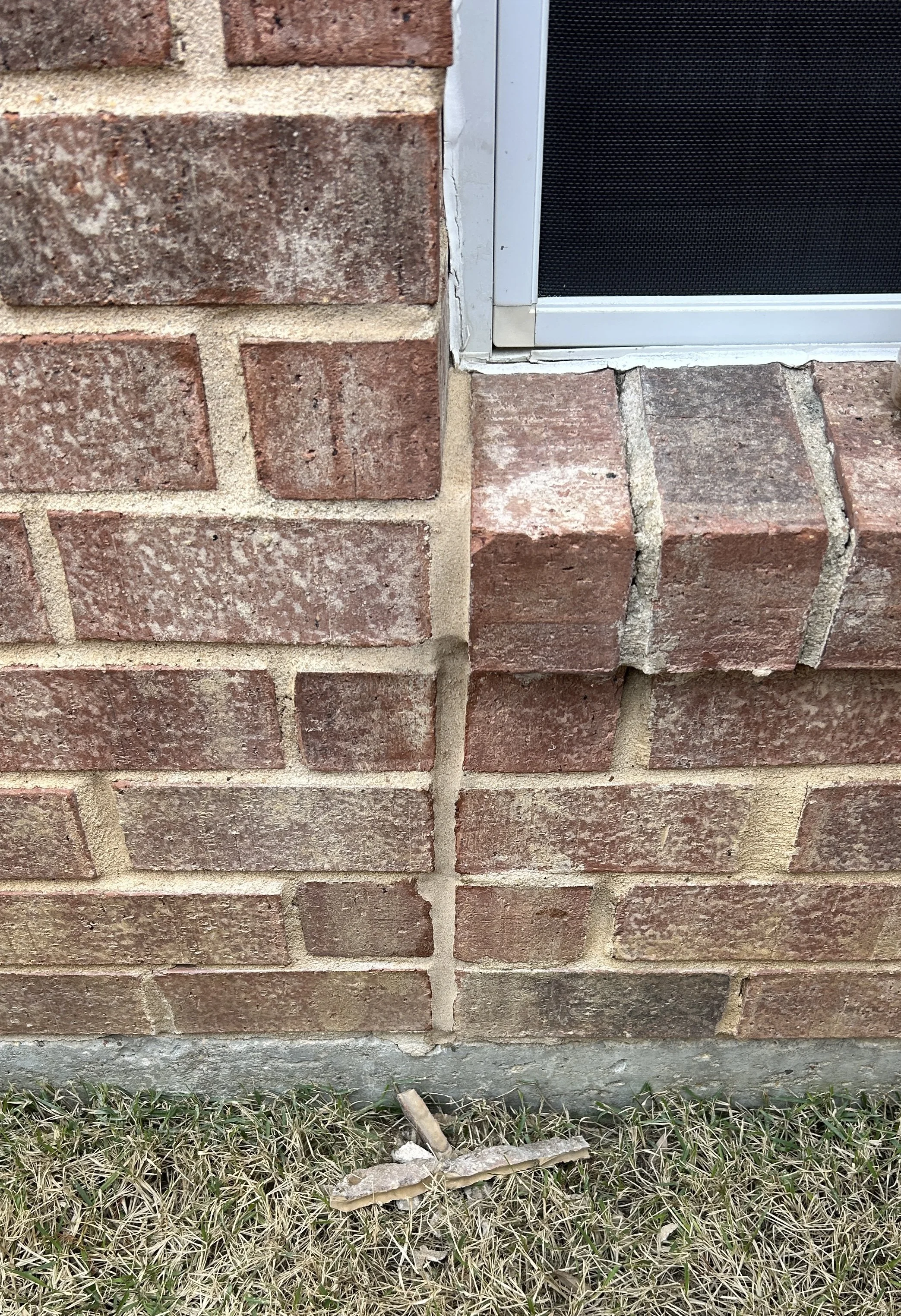 Brick expansion joint repair near window using flexible polyurethane sealant