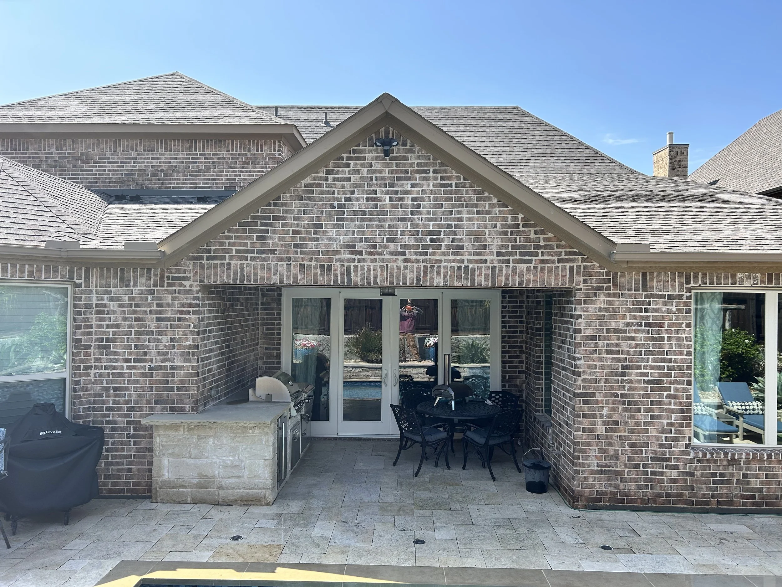 Structural brick reconstruction around large patio opening with rebuilt masonry