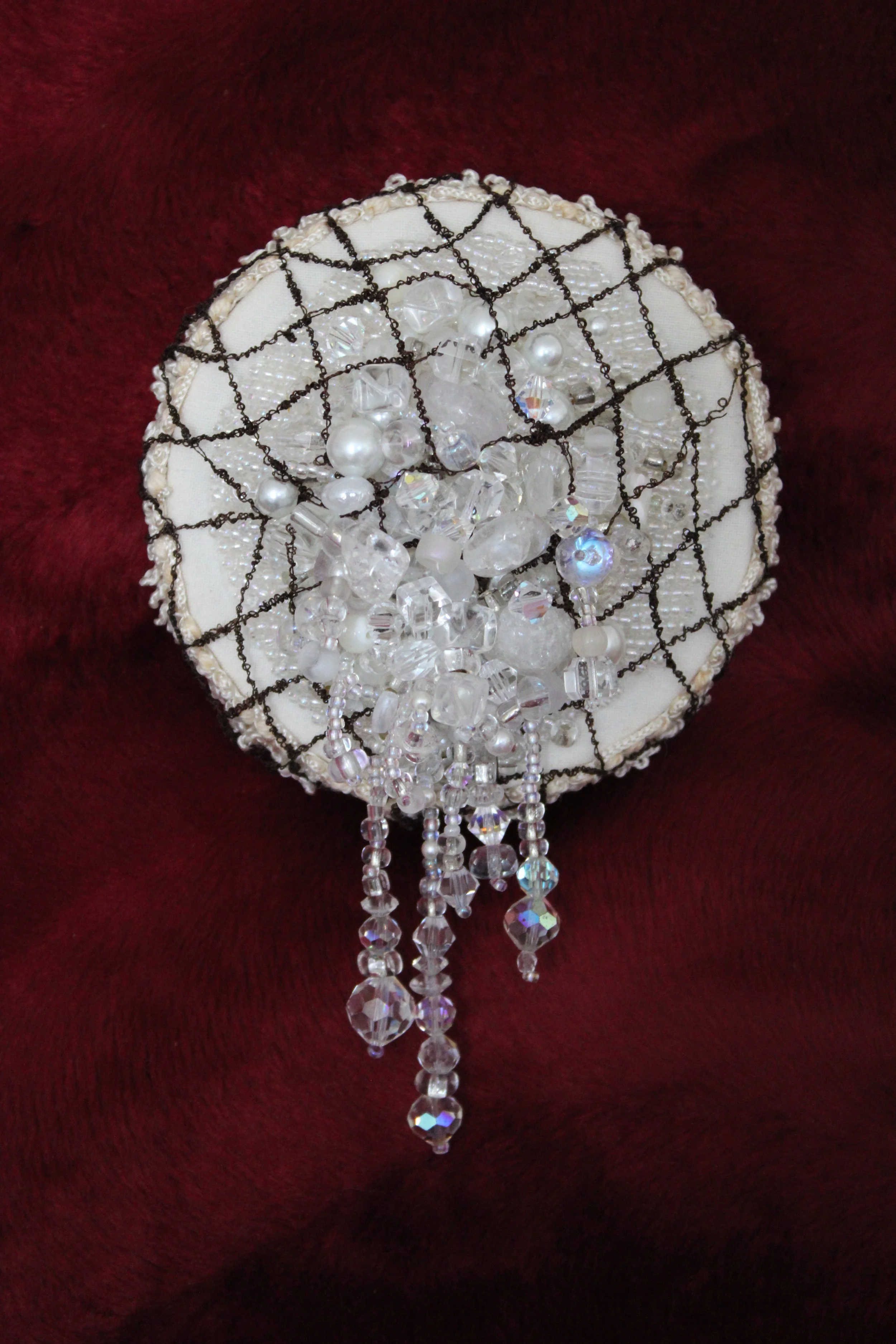 RileyLynch_Excess_2024_embroidery and beading, handmade net_3%22 diameter.JPG