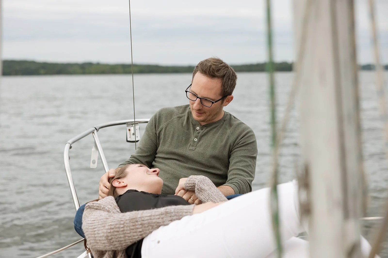 Couple enjoys time on a sailboat together in Tennessee.