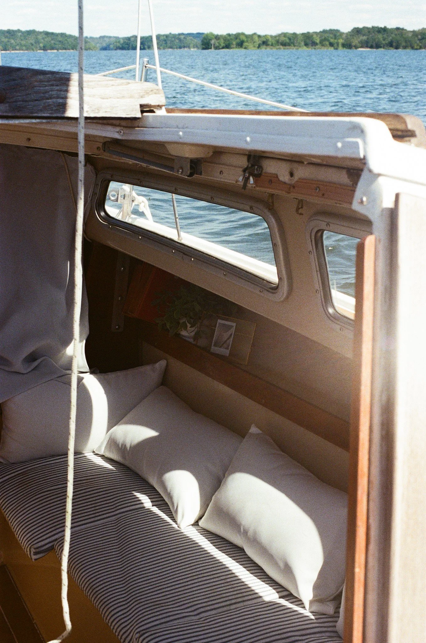 Whippoorwill's cozy Catalina 22 cabin bathed in sunlight.