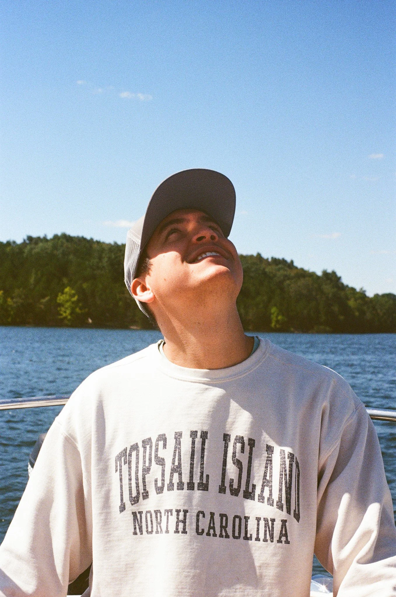 Captain of Whippoorwill Sailing Company looks up at sail.