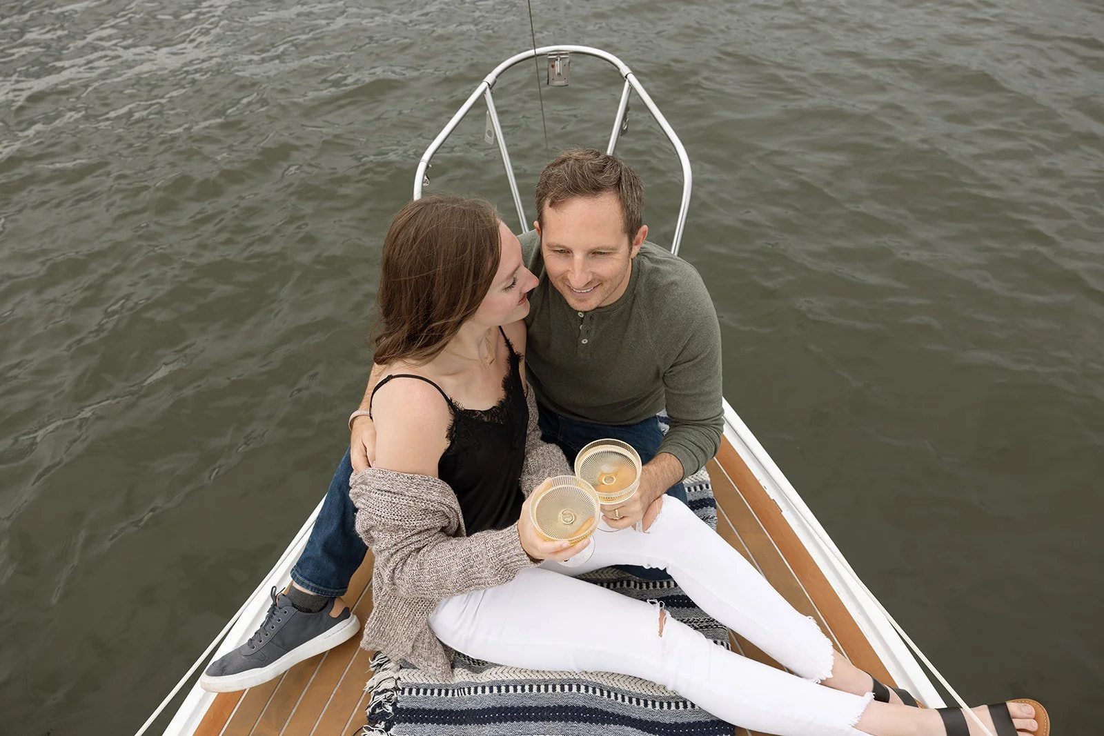 Couple cheers their champagne together aboard the Whippoorwill in Nashville.
