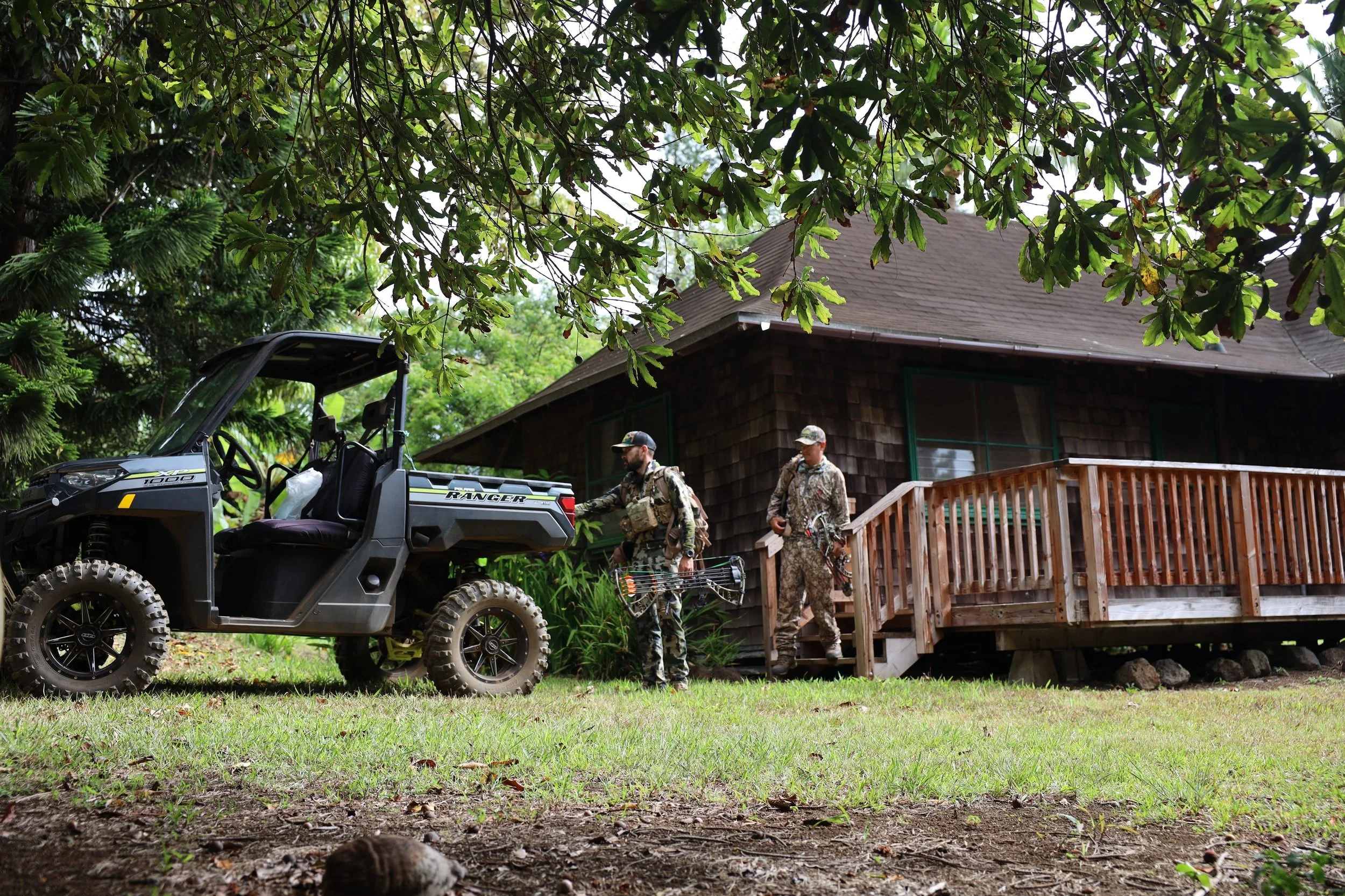 Hunters unload a Polaris Ranger side-by-side outside the lodge at Pu'u O Hoku Ranch