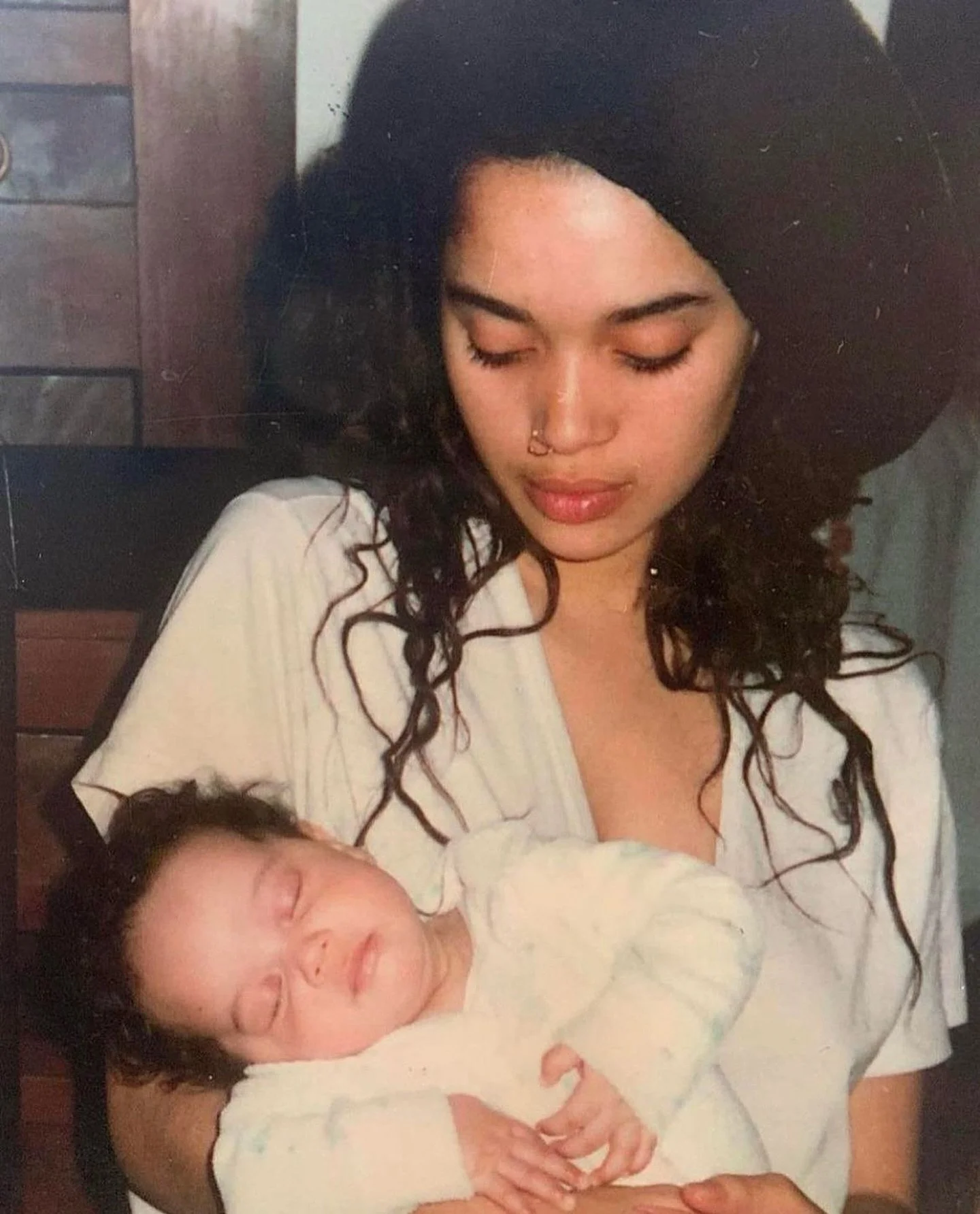 Out here surviving another bedtime! #aparentlykidding 

Lisa Bonet holding her daughter Zoe Kravitz 1989