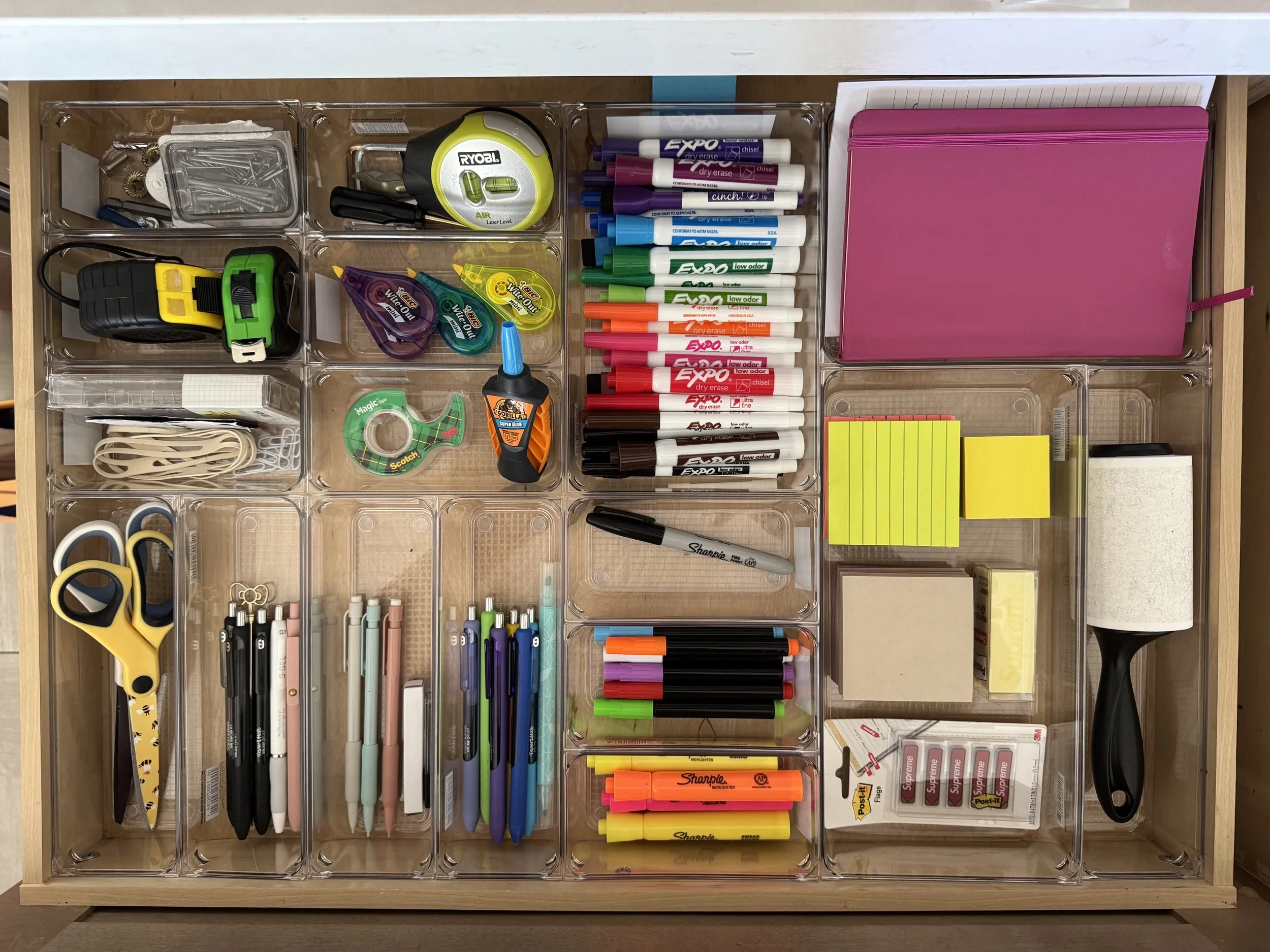 An organized office supply drawer