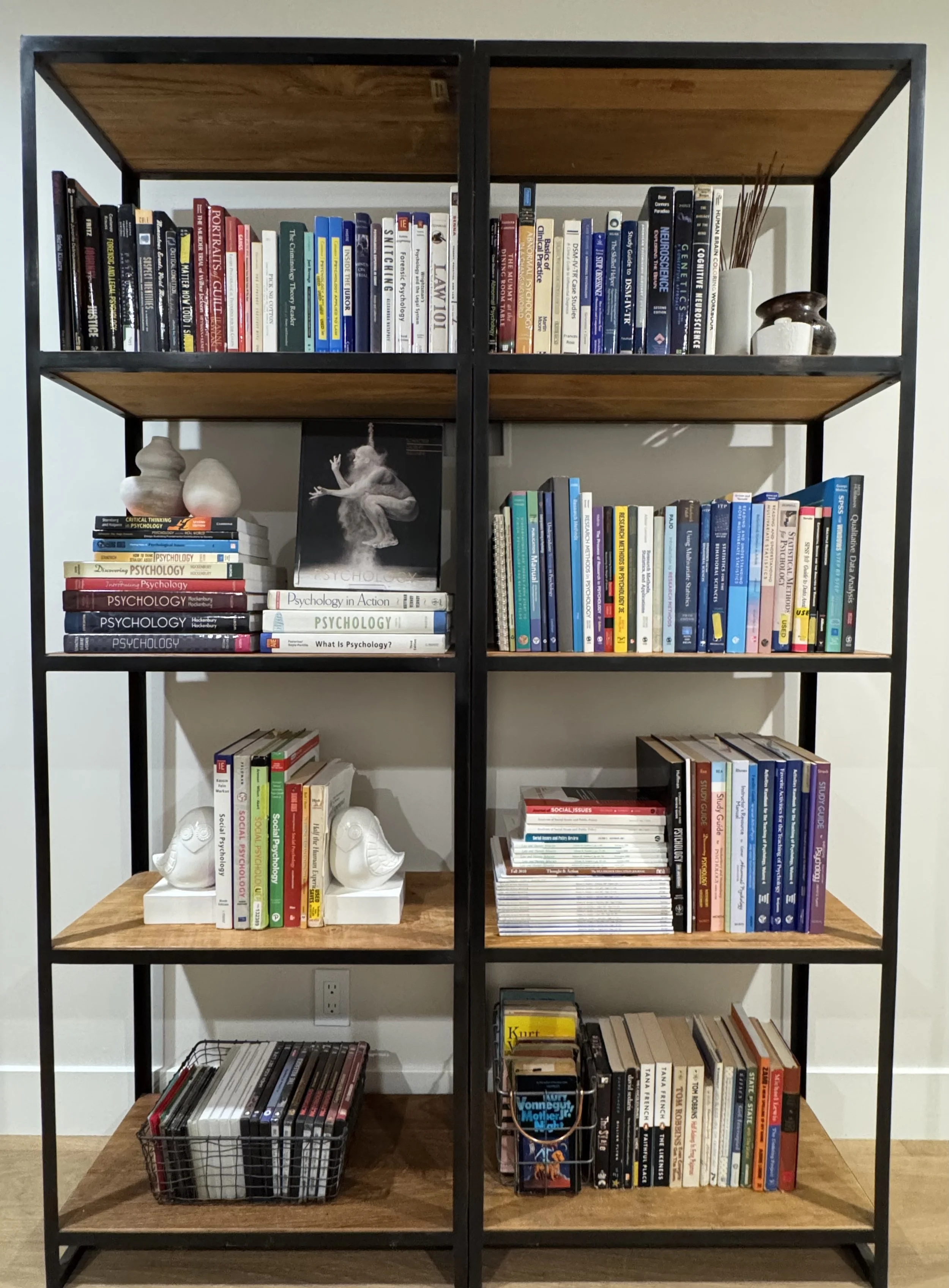 An organized book shelf in an office
