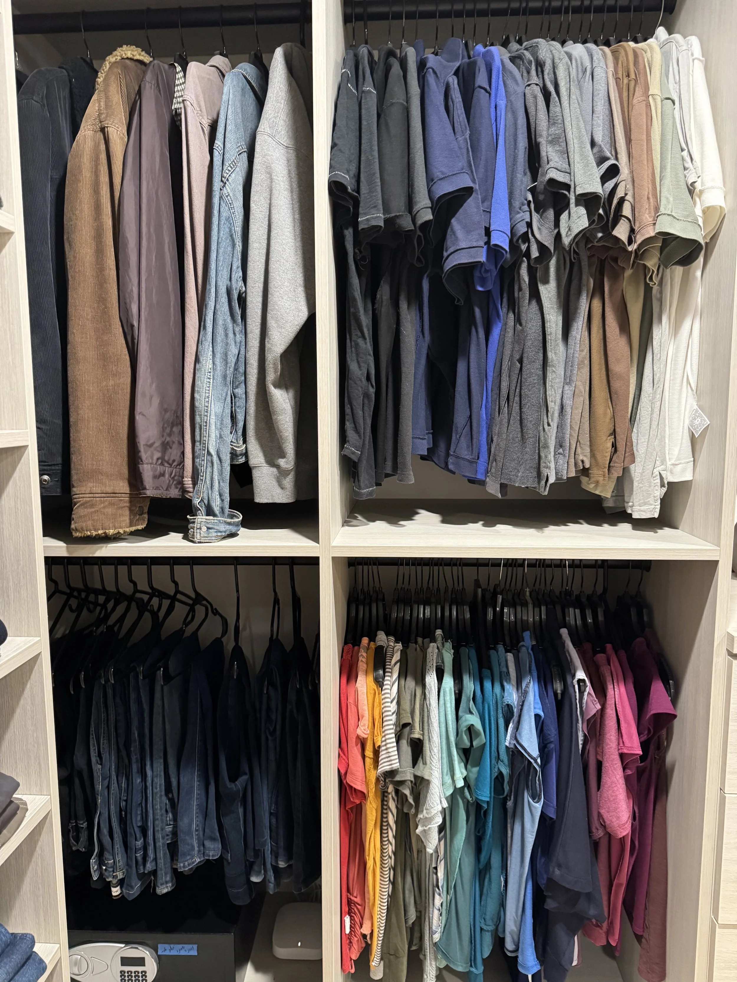 his and hers shirts in a walk in closet