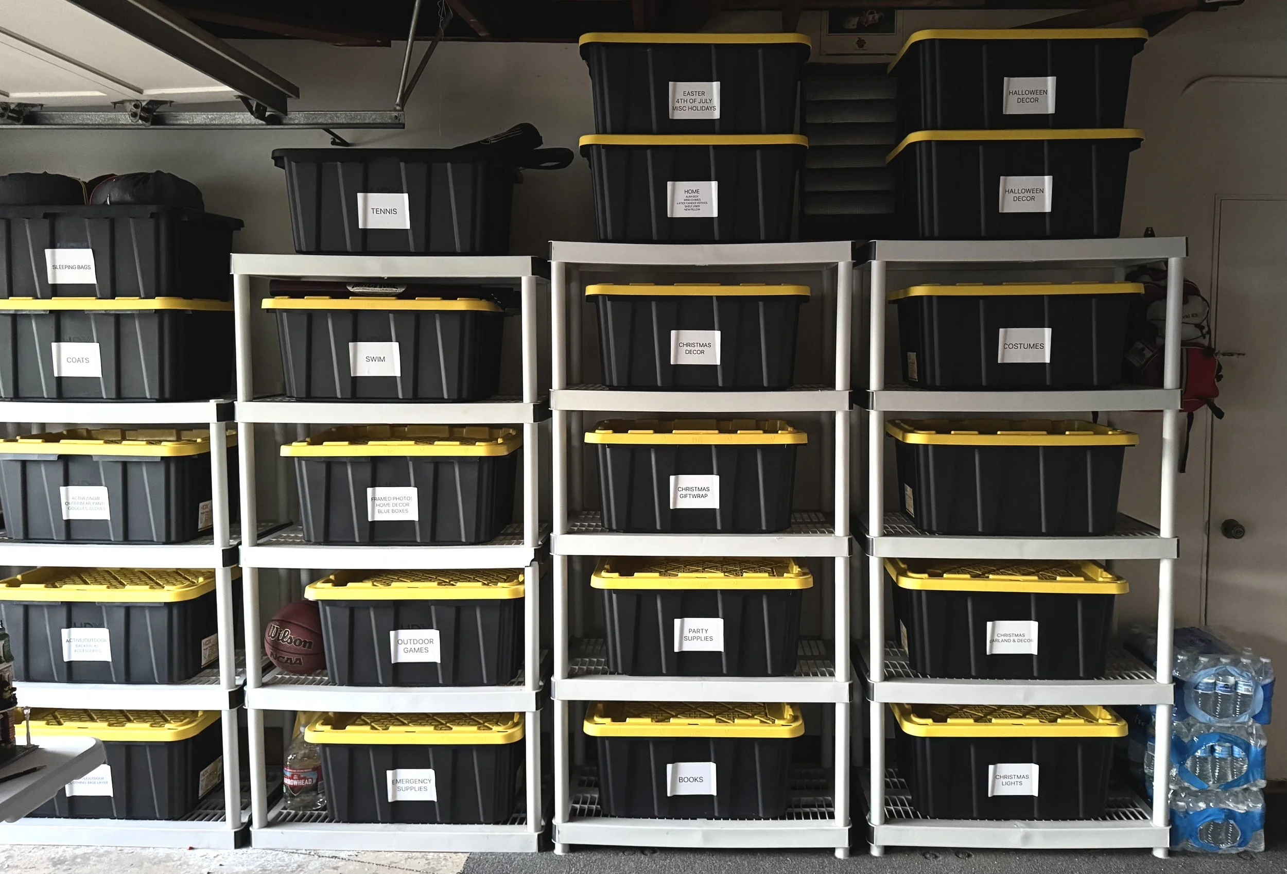 Bins stacked on shelves in an organized garage