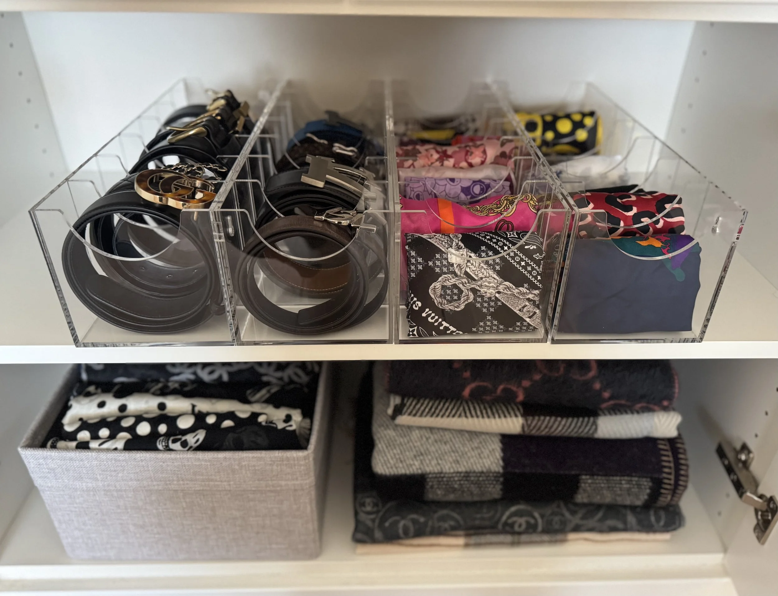Women's accessories like scarves and belts neatly stored