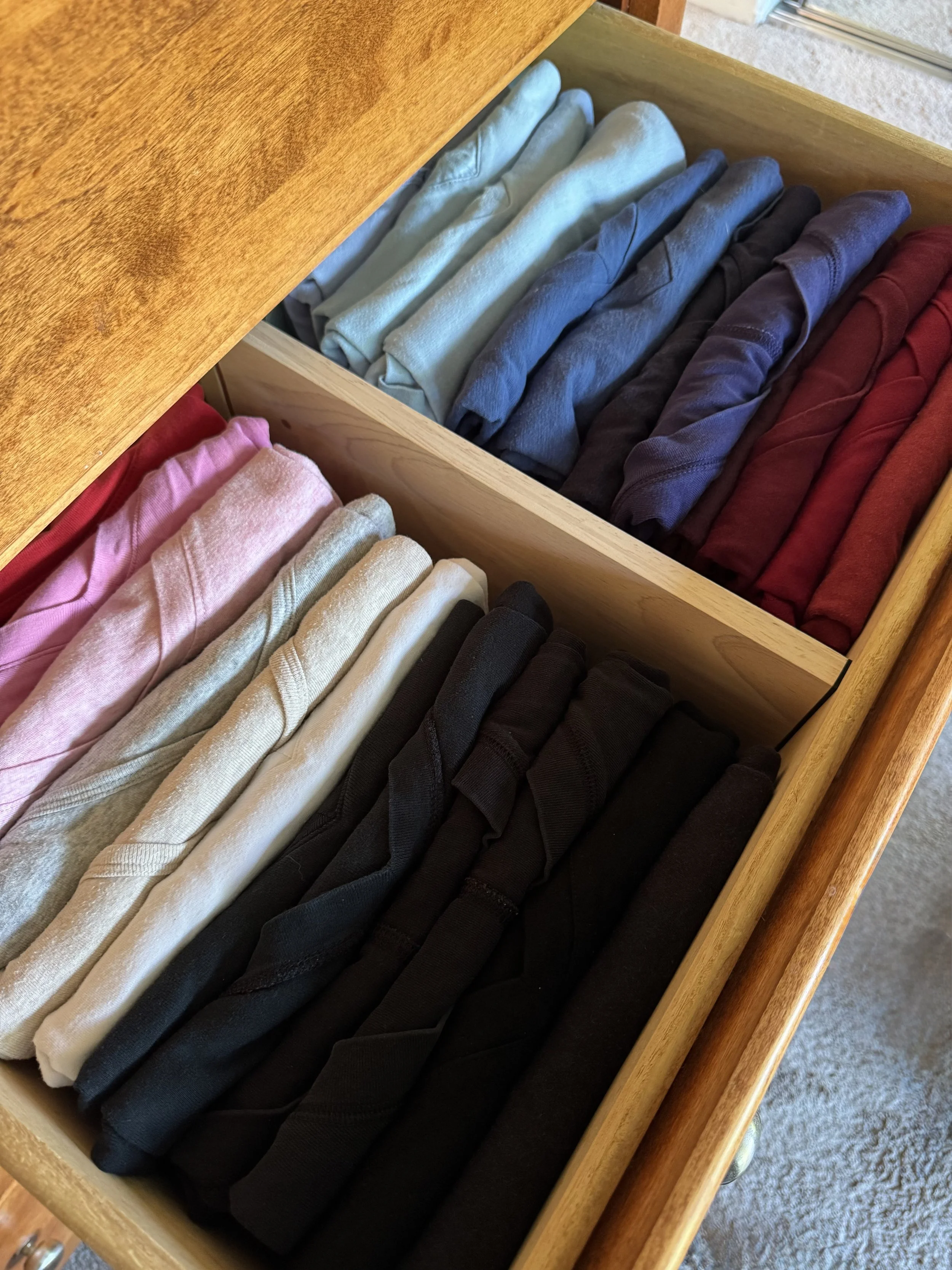 organized shirts folded in drawer