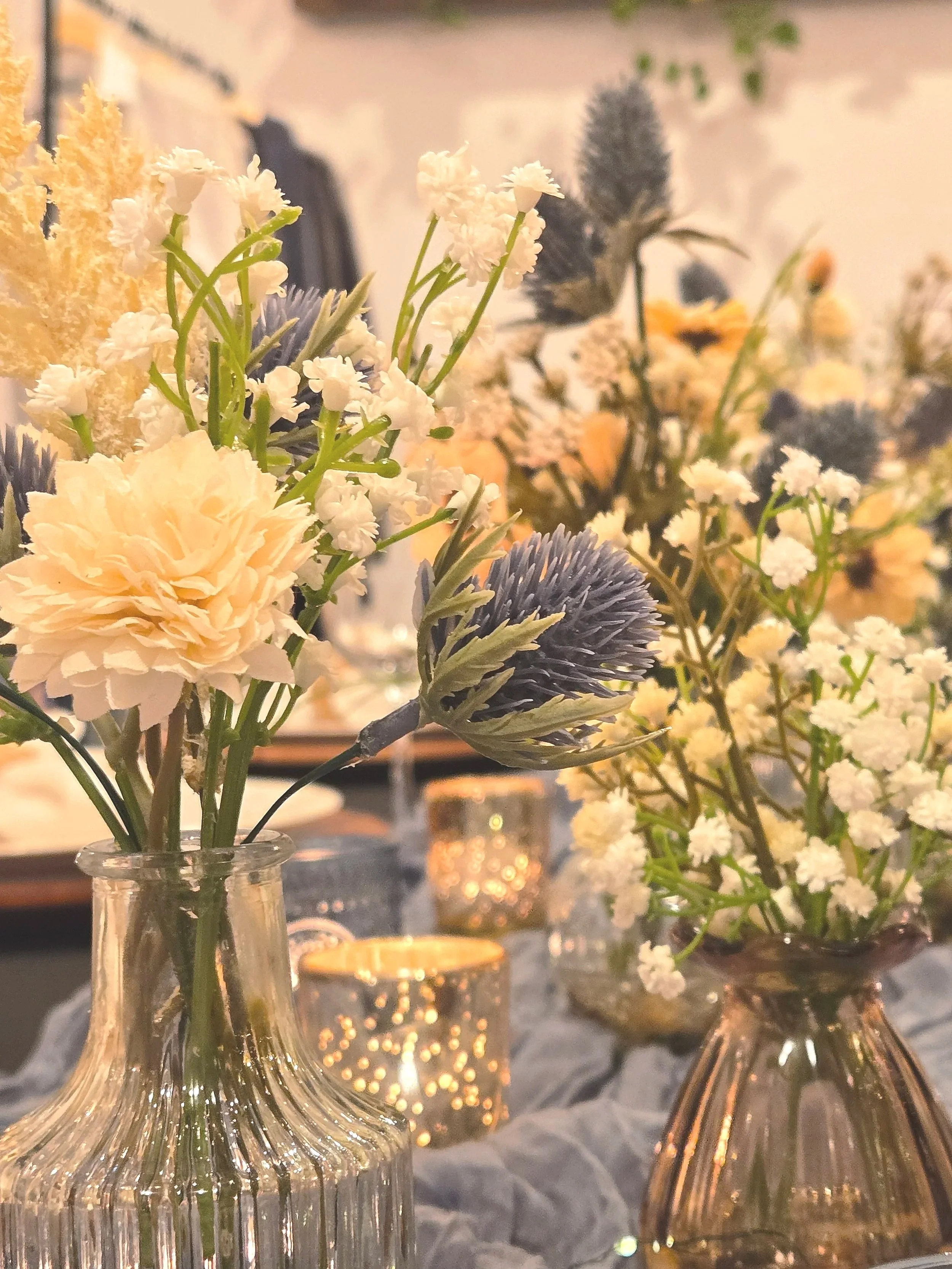 Budvases with blue and white flowers.  Oasis Collective Venue in Sarasota, FL