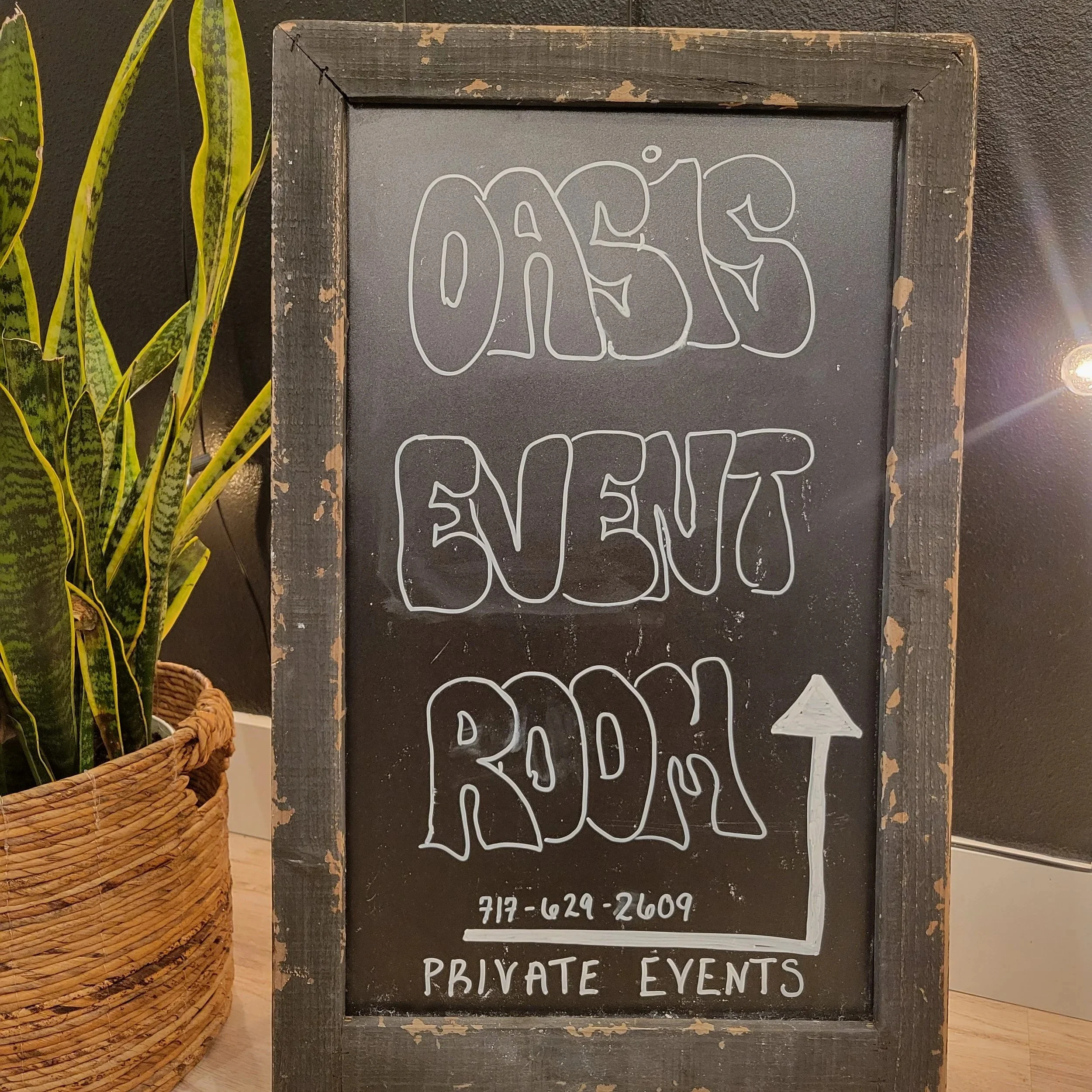 A sign directing our guests to the event room at Oasis Collective | Sarasota, FL
