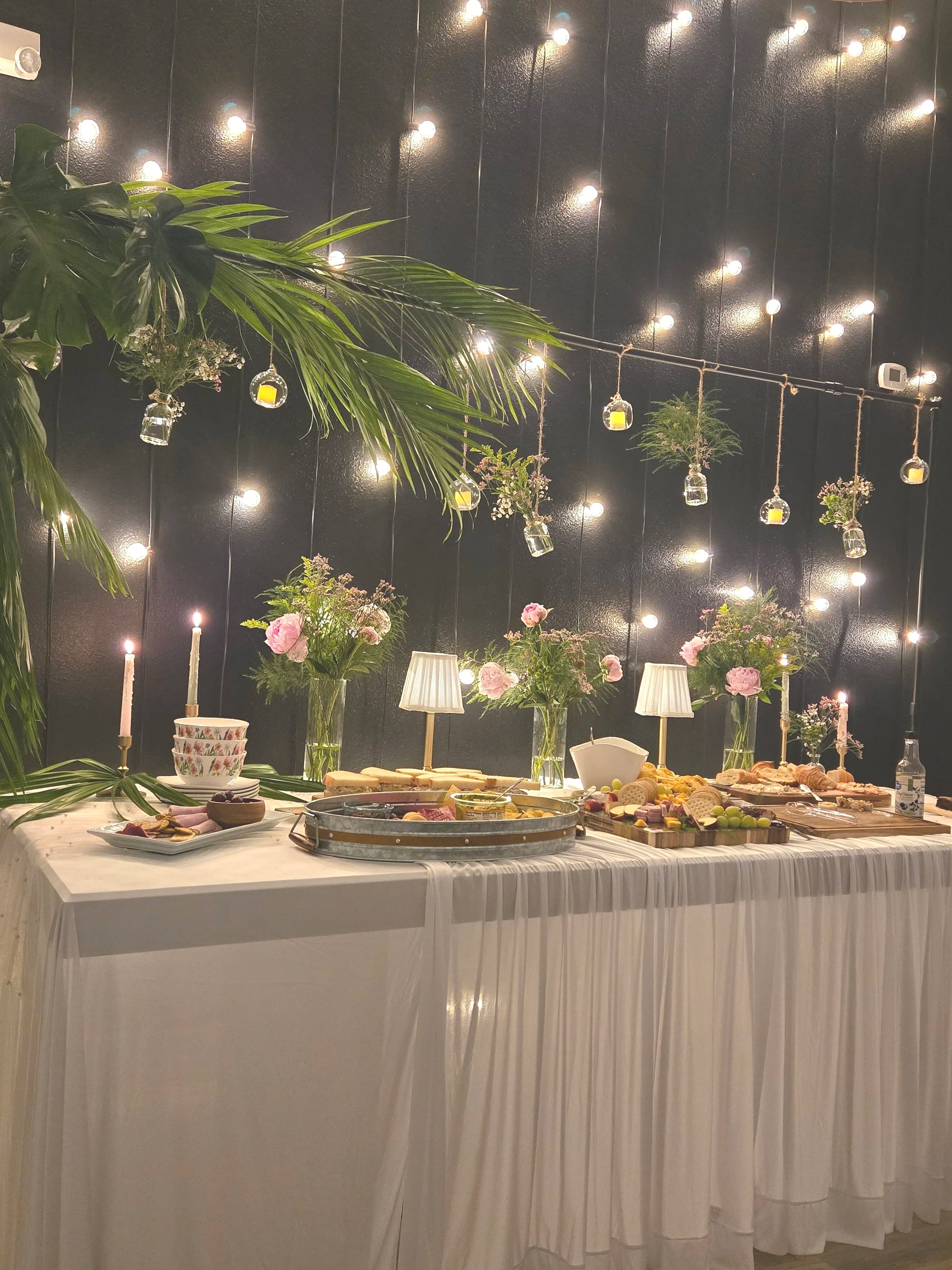 A table with food at Oasis Events Collective in Sarasota Florida.  Cozy and intimate for baby showers, bridal showers and birthday parties near Bradenton and Parrish.