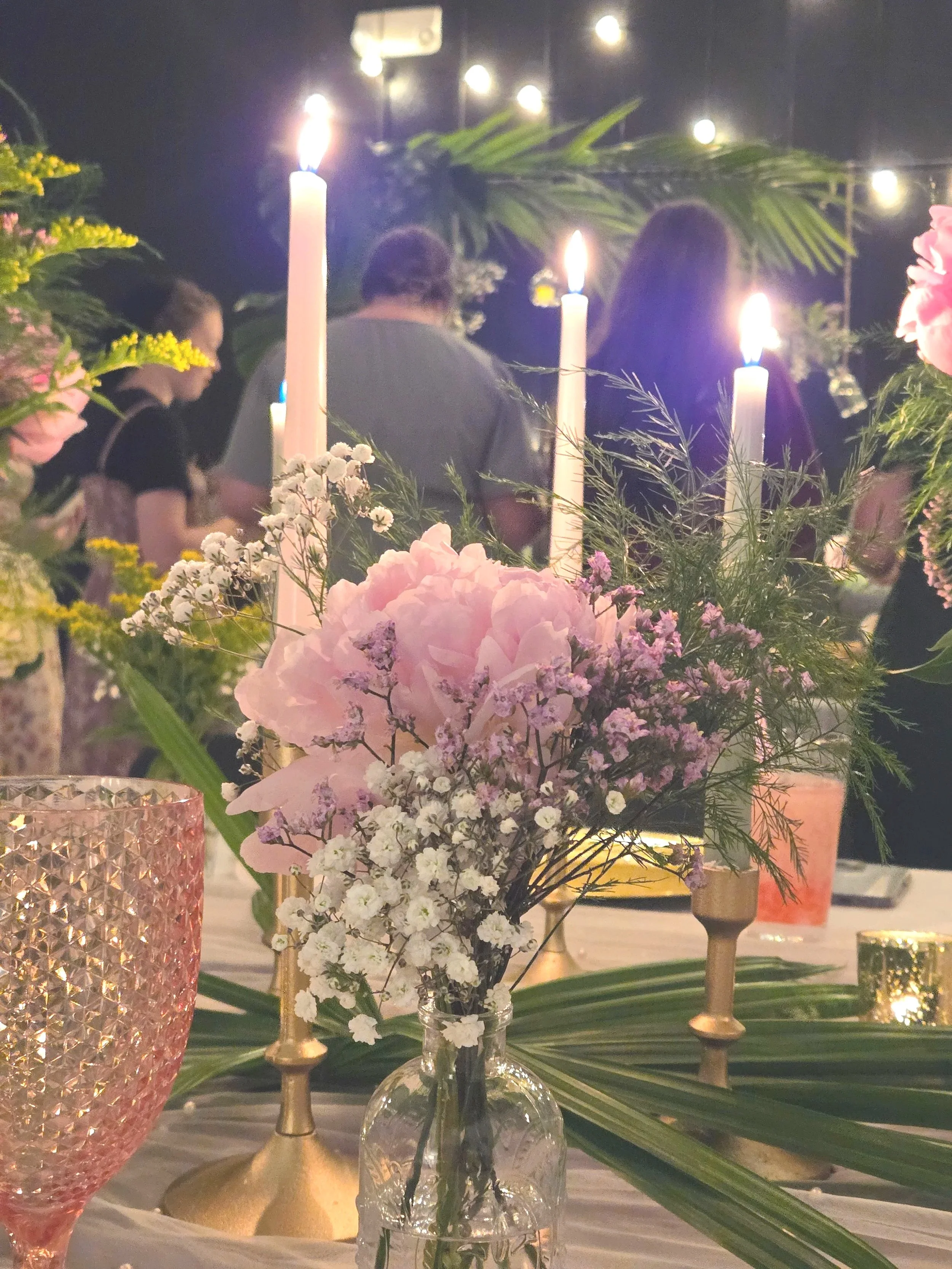 Candles and flowers at Oasis Events Collective event s venue in Sarasota Florida.  Cozy intimate space for baby showers, gender reveals, Bibles Studies, pop-up shops, and bridal showers.  Serving Bradenton, Lakewood Ranch, and Parrish.  Lots of decor