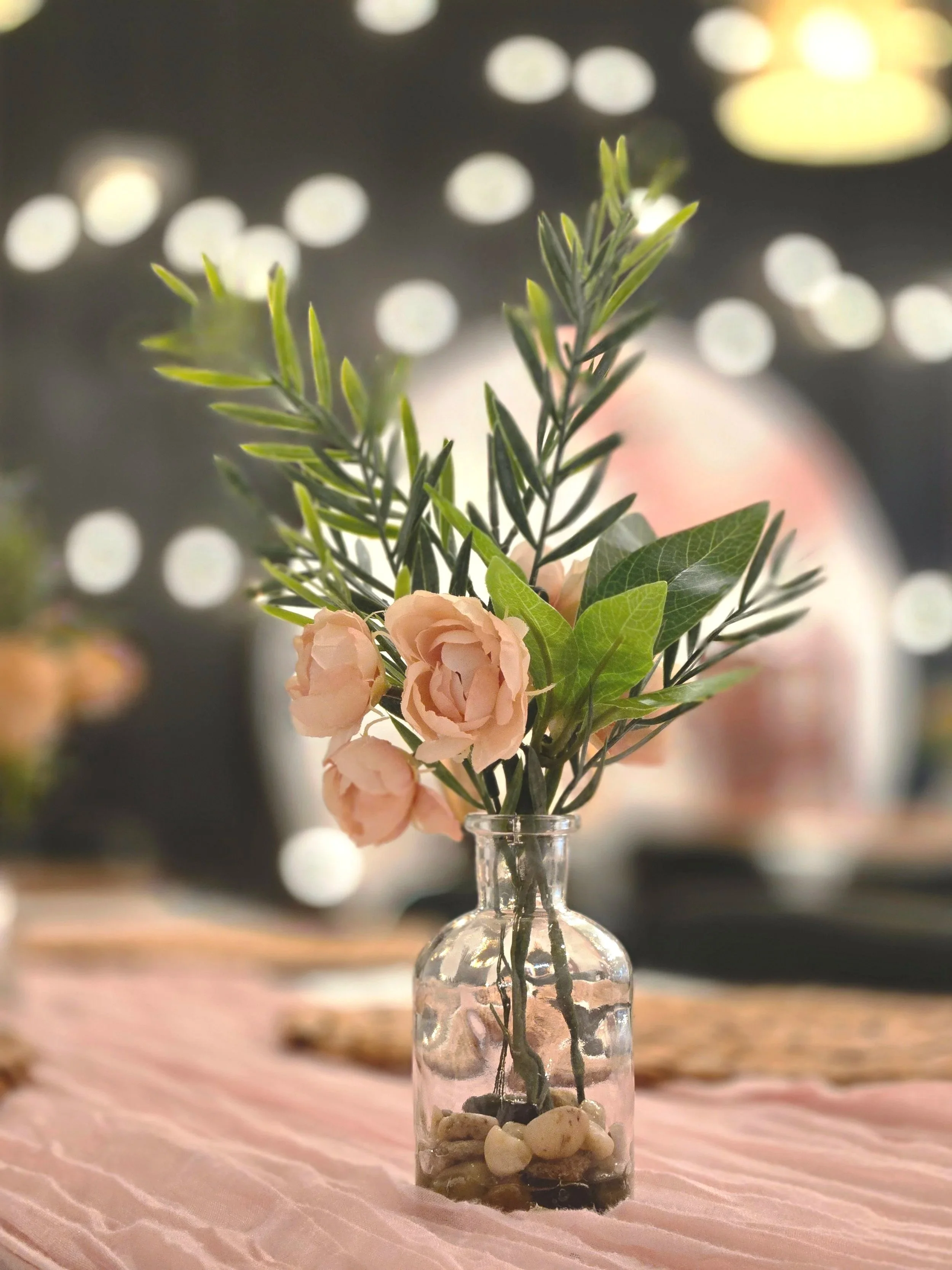 Pink budvase at girl baby shower at Oasis Events Collective in Sarasota Florida.  A cozy event venue for baby showers, bridal showers, and engagement parties.