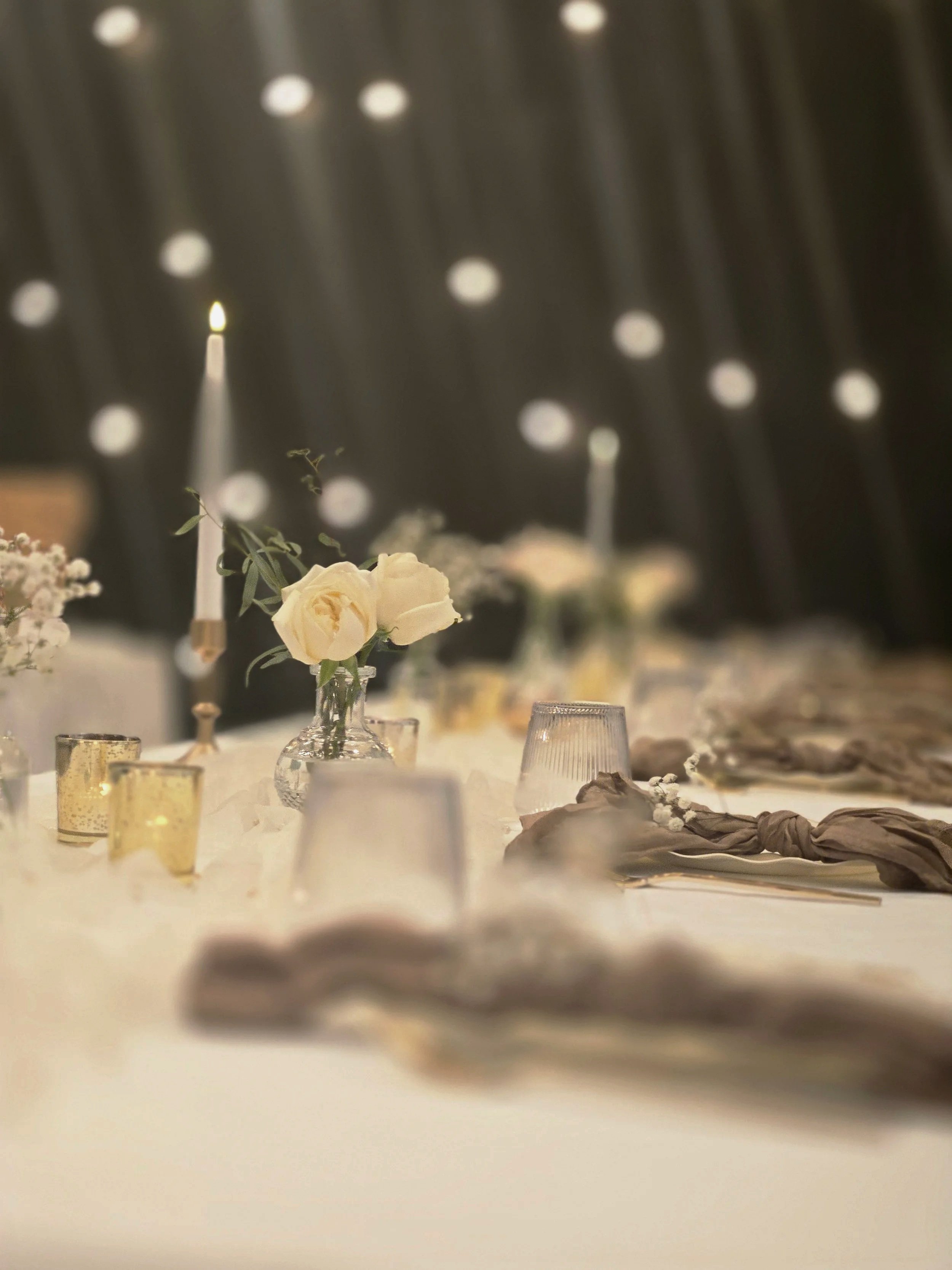Elegant table setting with florals and candles at Oasis Events Collective in Sarasota, FL