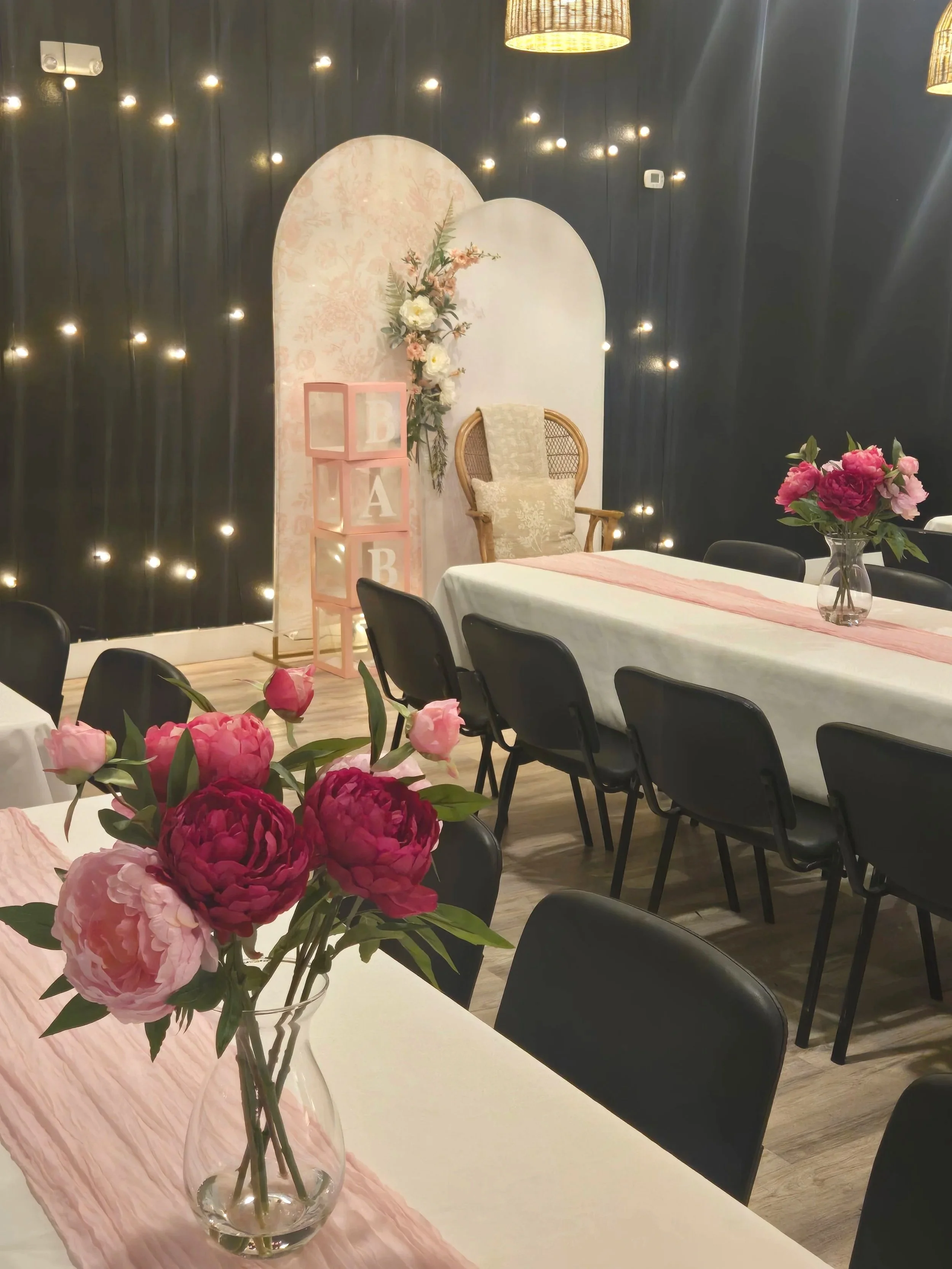 Pink floral table setup for a baby shower at Oasis Events Collective in Sarasota