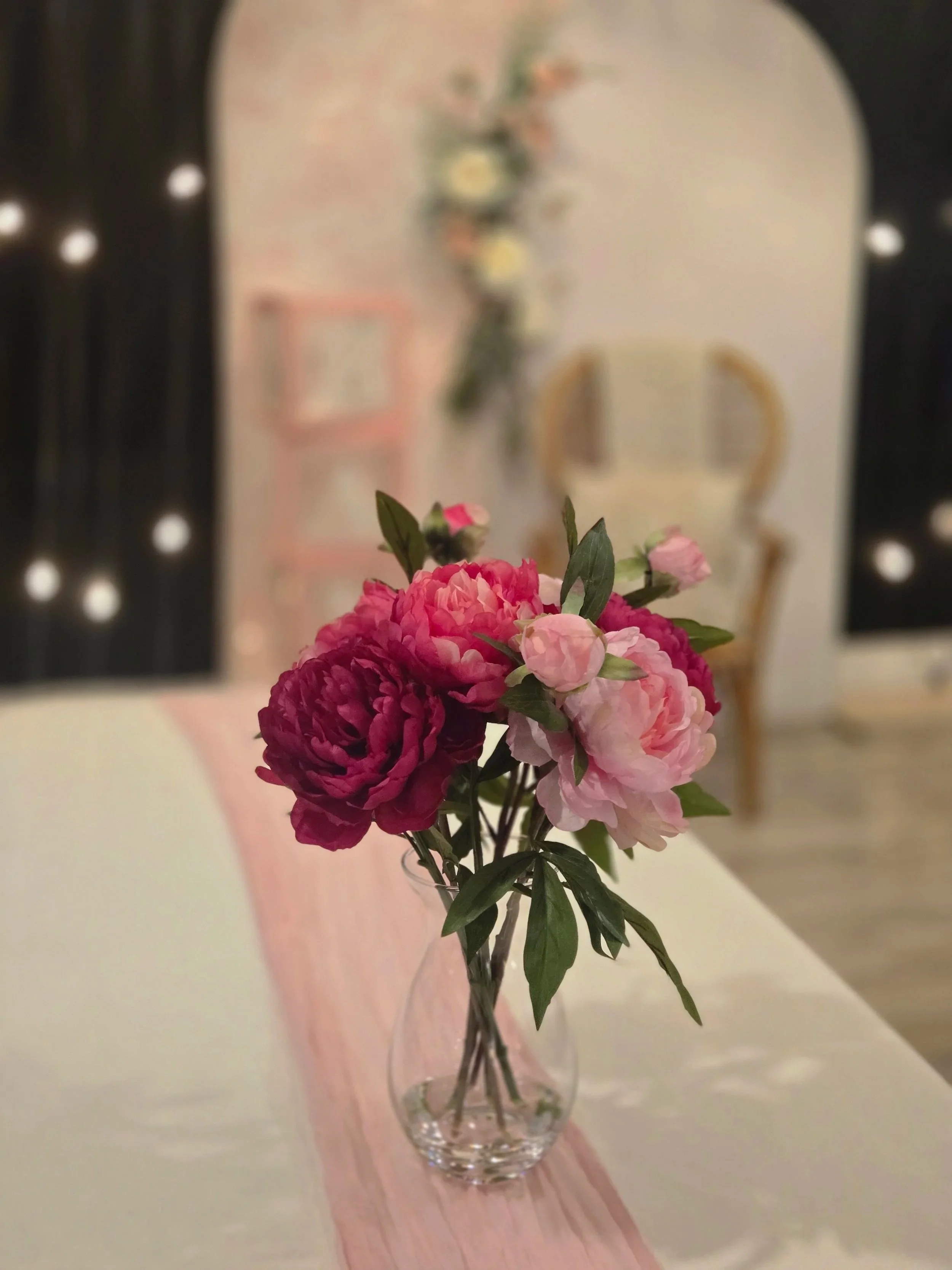 Pink florals on table at baby shower at Oasis Events Collective in Sarasota, FL