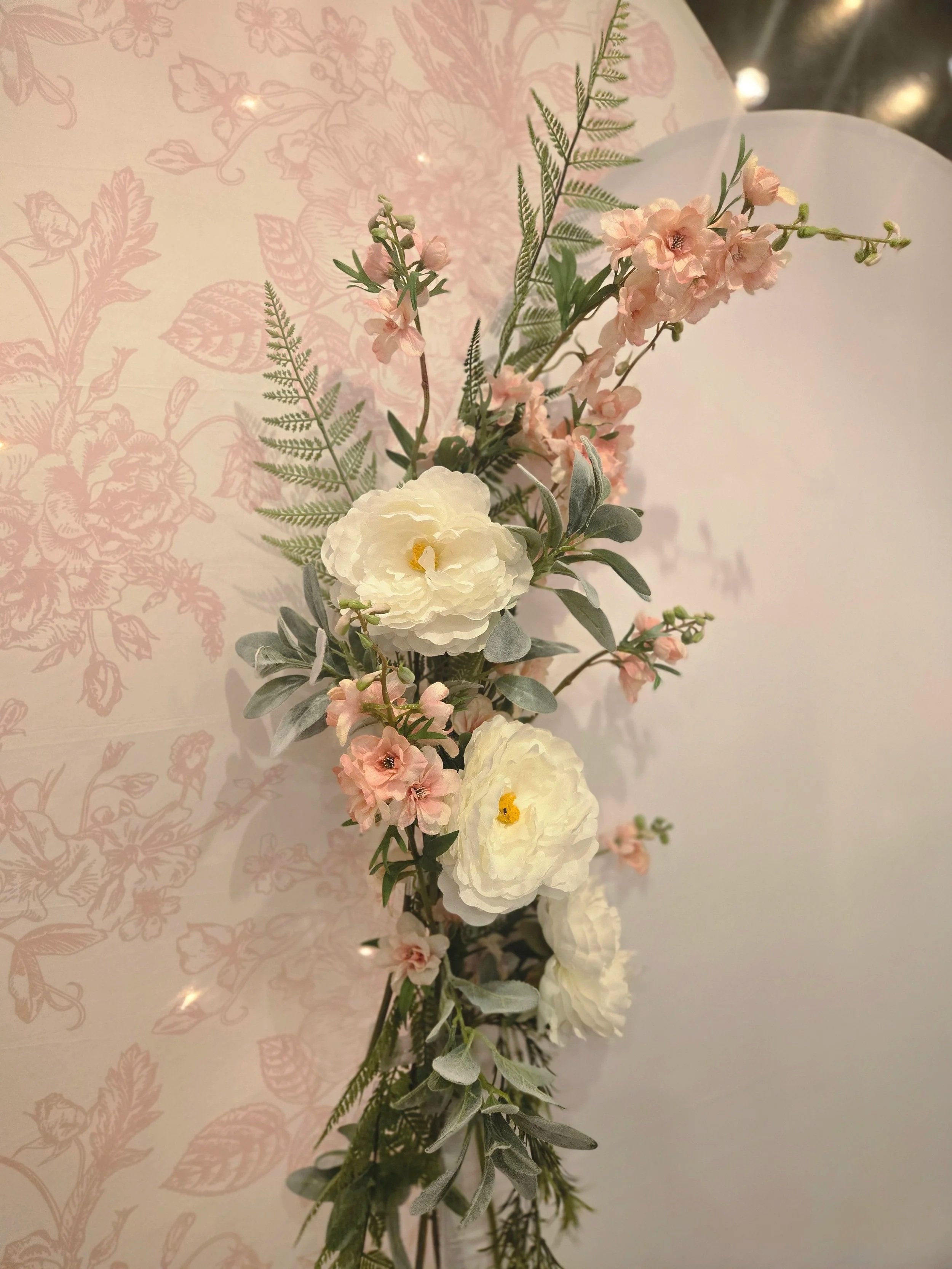 Floral arrangement on arches at a baby shower at Oasis Events Collective in Sarasota, Florida.  Also serving Lakewood Ranch, Venice, and Parrish