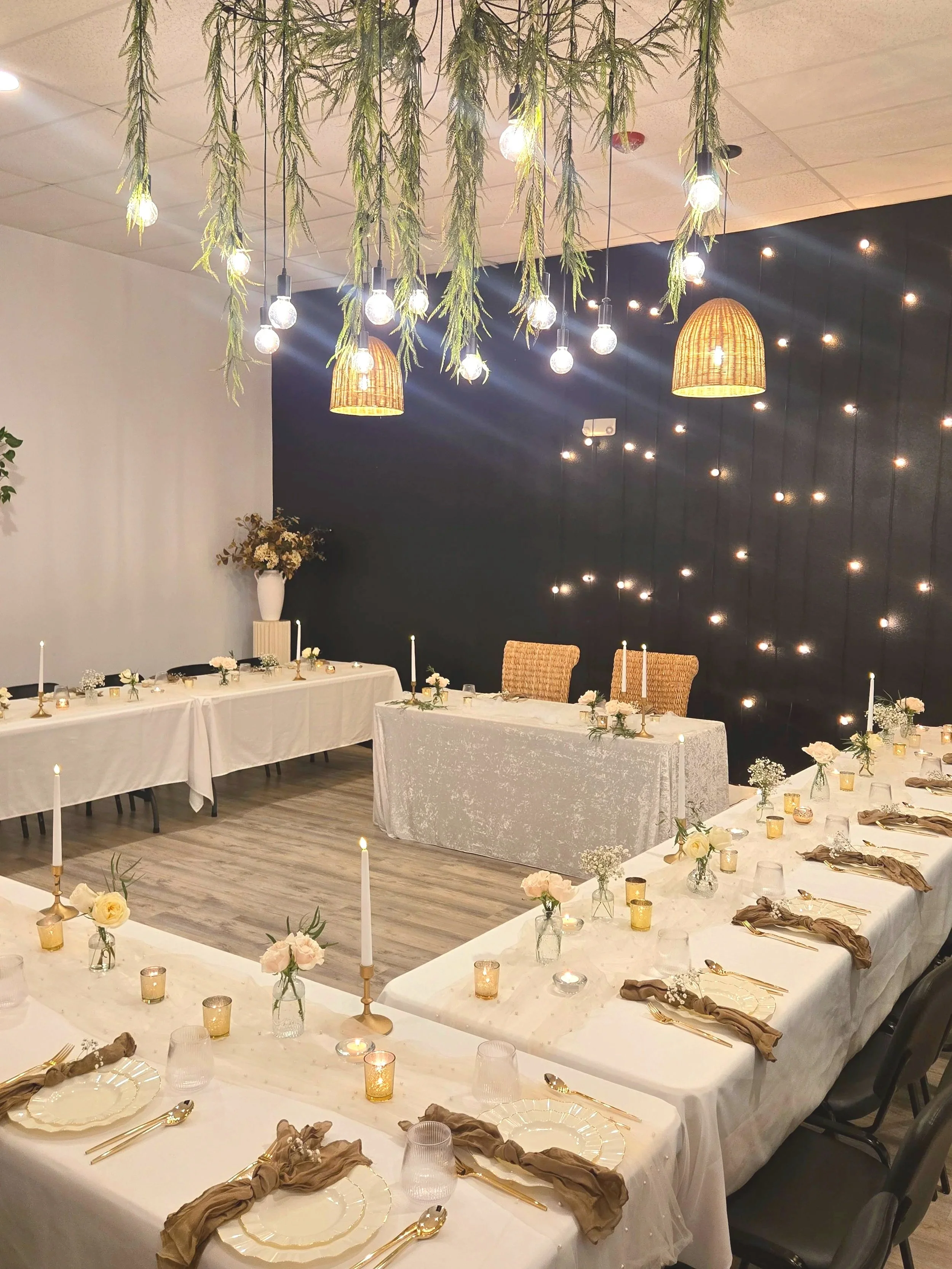 Tables, chairs, tablecloths, napkins, candles on table-scape at a rehearsal dinner at Oasis Events Collective in Sarasota FL