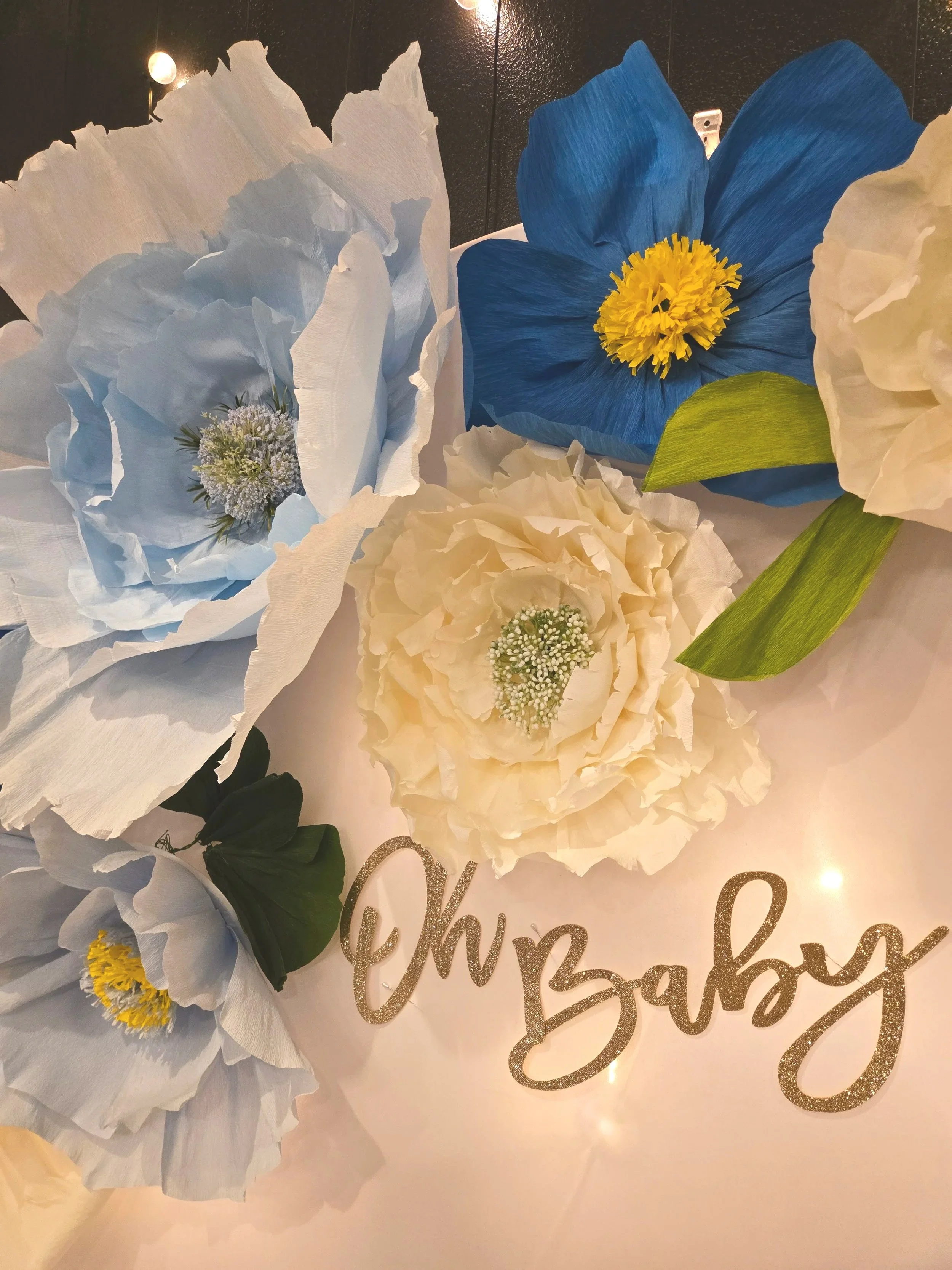 Large floral backdrop for baby showers at Oasis Events Collective's venue in Sarasota, FL