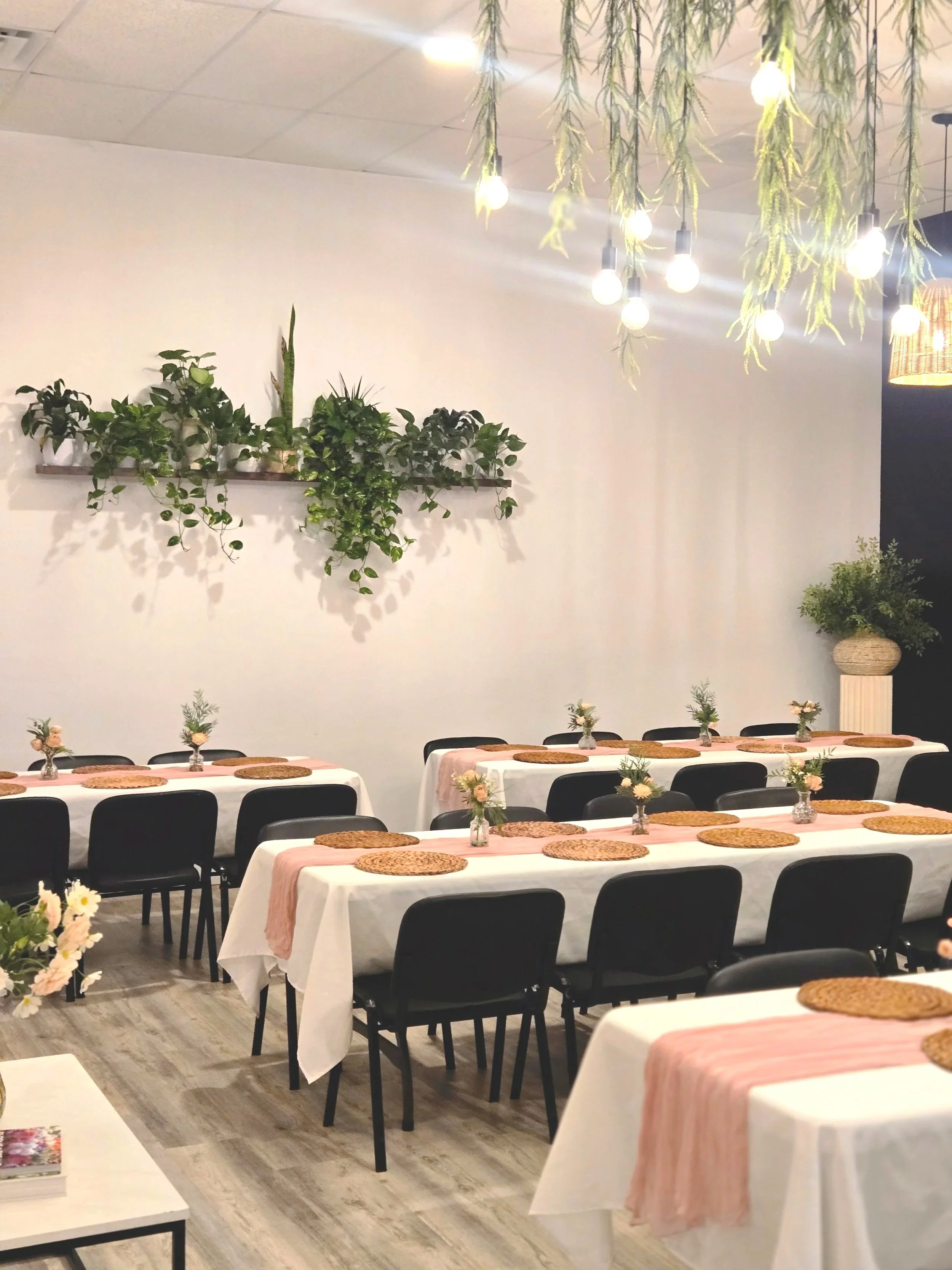 Tables setup in the Oasis Events Collective venue for a baby shower in Sarasota Florida