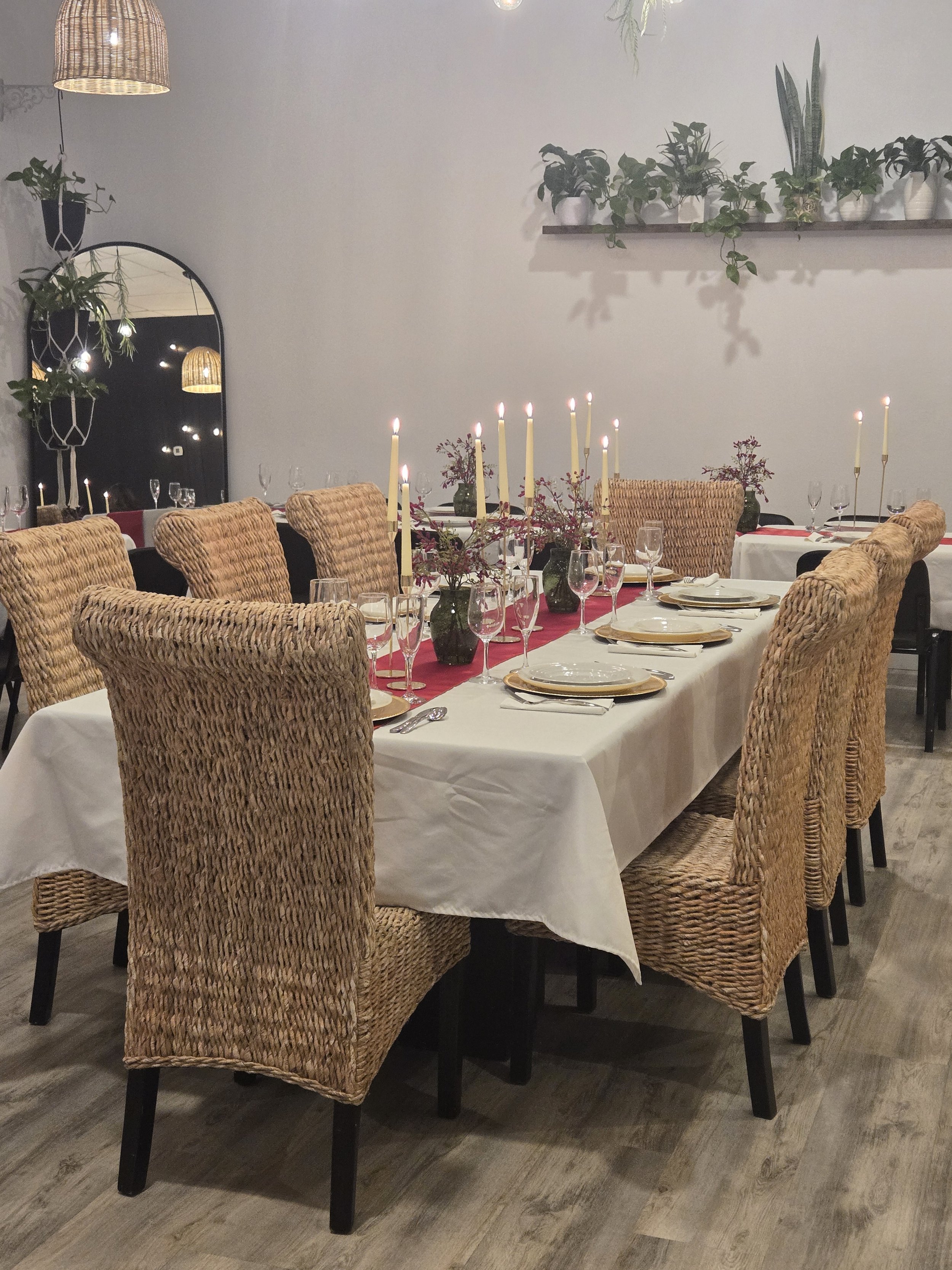 Italian Themed Rehearsal Dinner at Oasis Events Collective in Sarasota FL.  Also serving Lakewood Ranch, Ellenton, Bradenton. Intimate Event Venue, cozy, gold chargers with gold candlesticks, wicker chairs