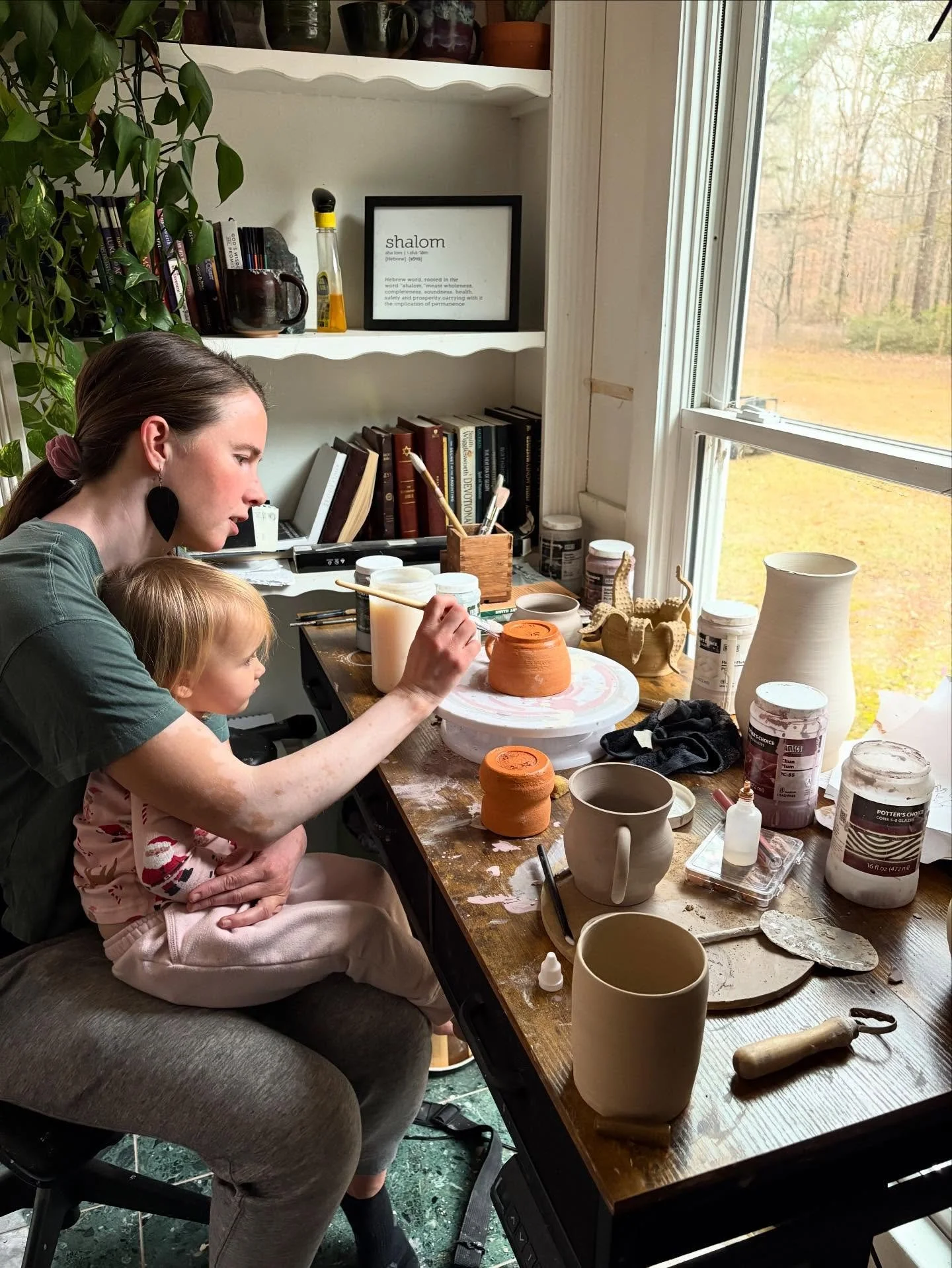 There&rsquo;s magic here. 
In the house at the edge of the woods. 
With windows full of light and floor full of clay. 
Shelves crammed with every shape and size pot half-baked, glazed and awaiting their final trip into the fire. 

There is art in the