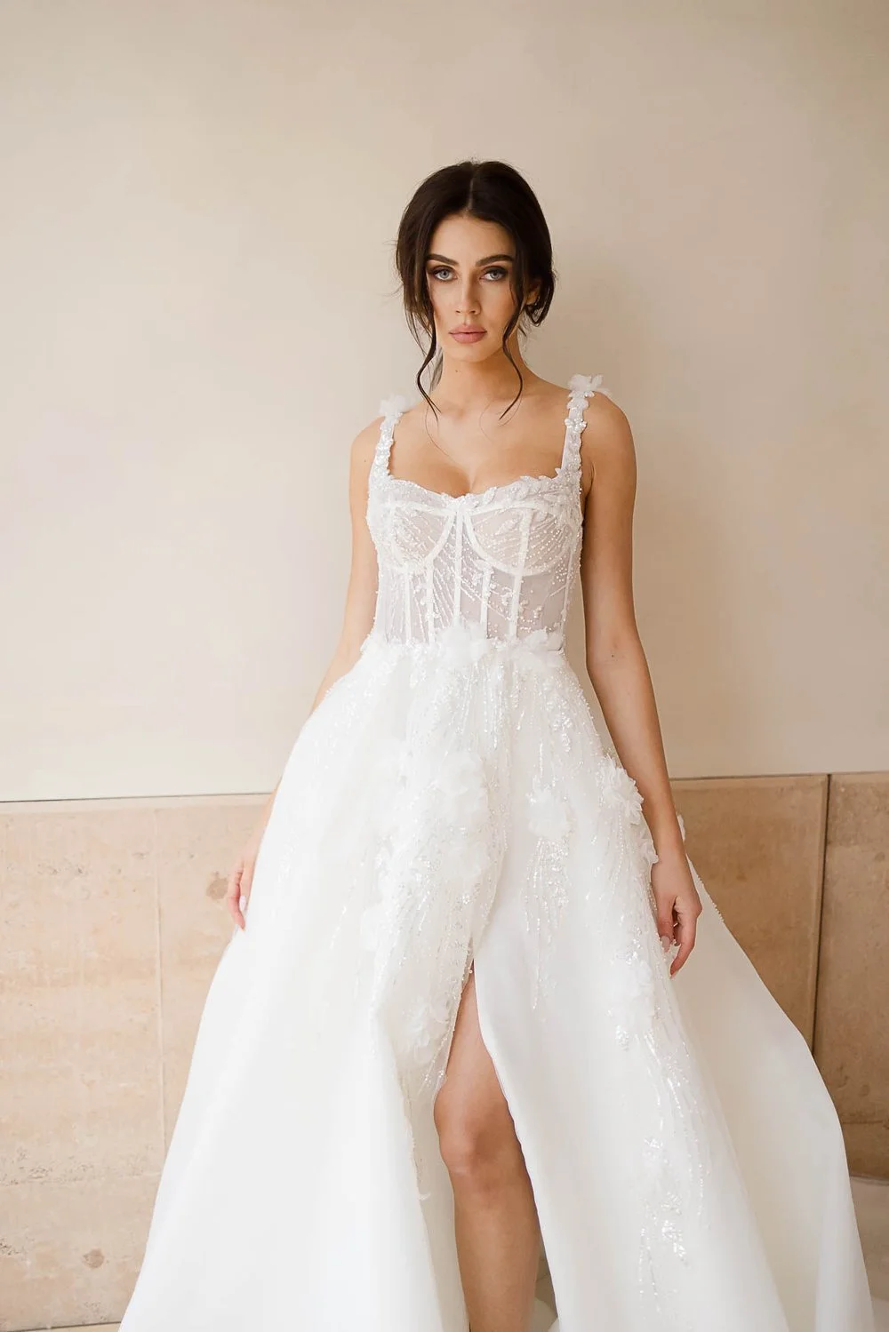 Bridal gown with lace details and floral appliques