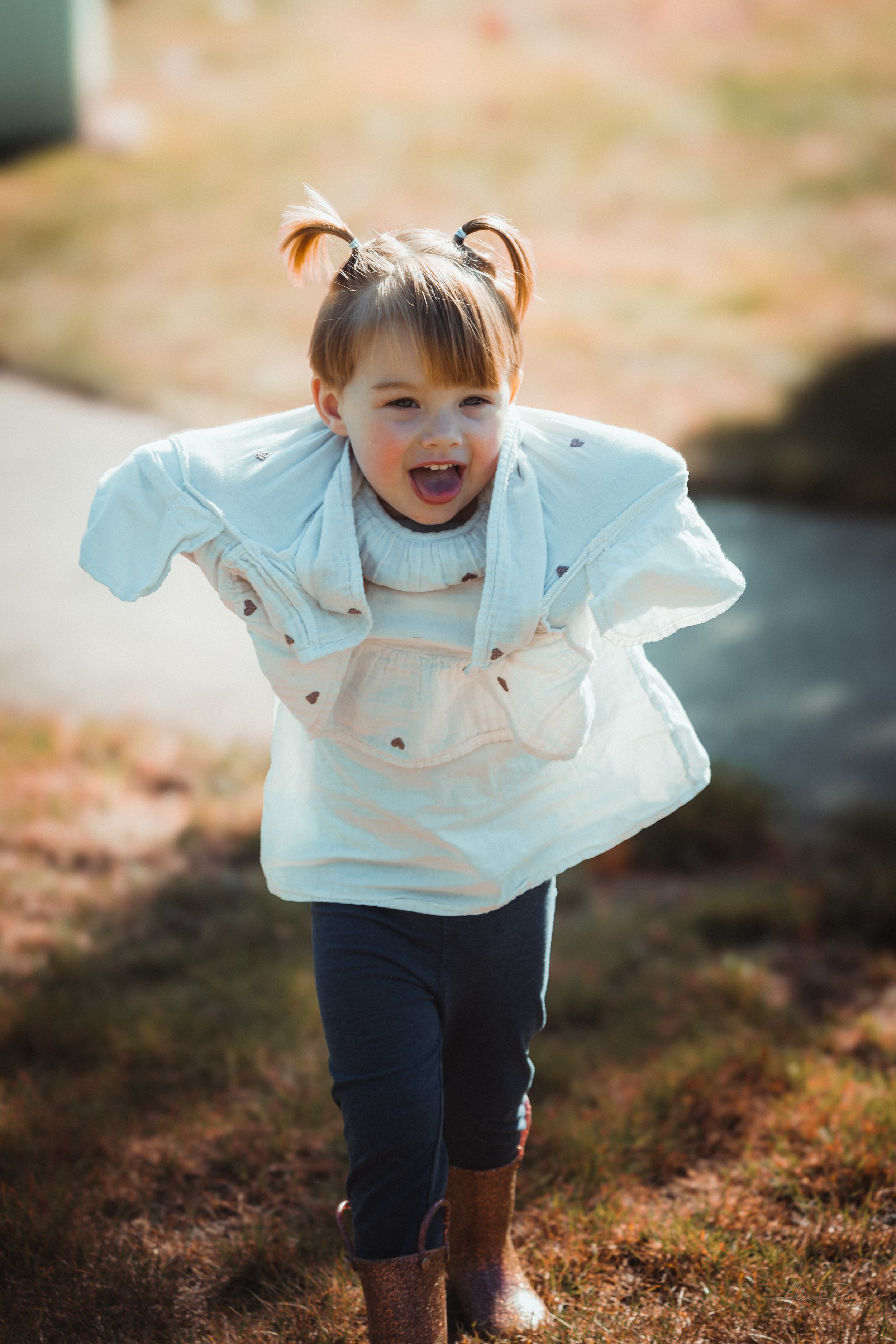 little girl having fun during a family photo shoot  in Tumwater, WA – Pacific Northwest lifestyle family and children's photography.