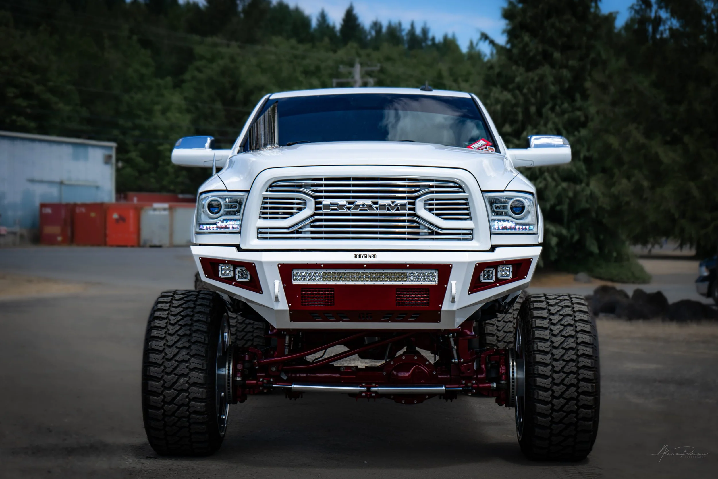 Aggressive front stance of a custom lifted white Ram 2500 showing off a massive Kelderman air suspension lift, Bodyguard front bumper, and polished forged wheels.

Short-Tail Keywords: Lifted Ram 2500 stance, Kelderman air lift, Bodyguard front bumpe