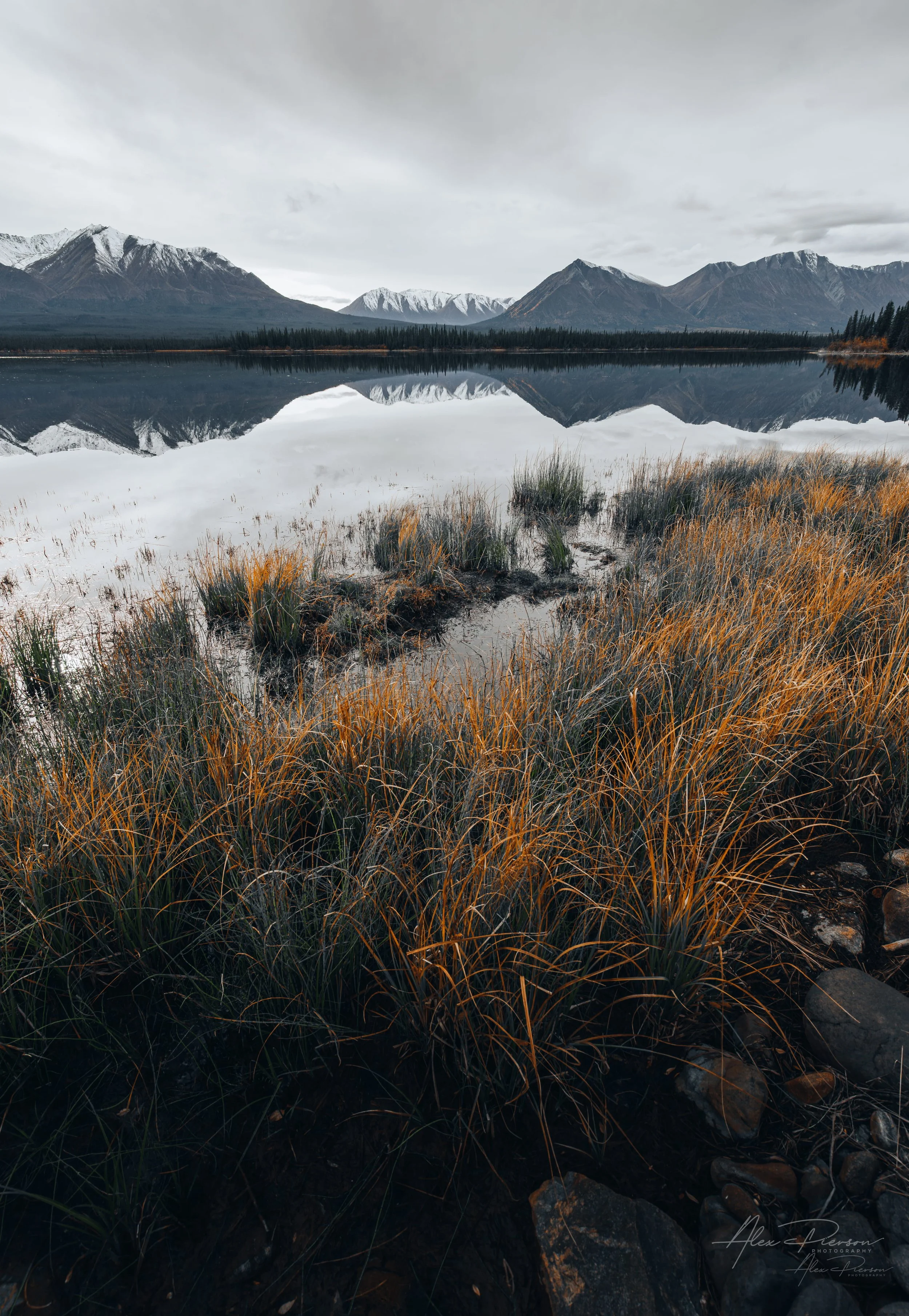 reflective-lake-alaska-highway-snow-peaks-autumn.jpg