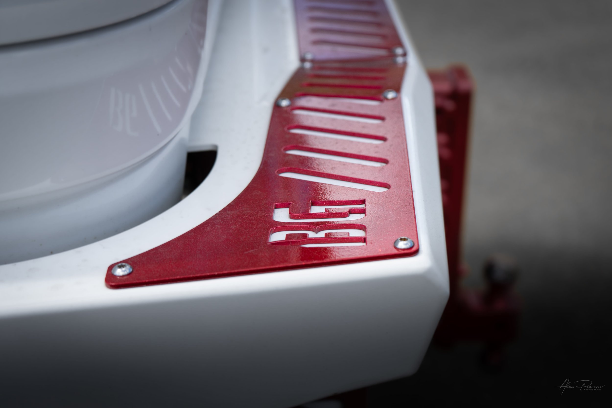 Detail shot of a color-matched white Bodyguard rear truck bumper featuring a custom candy red step tread plate with the BG logo cutout.
Bodyguard bumper, custom truck bumper, Ram 2500 rear bumper, BG truck bumpers.
color-matched white Bodyguard rear 