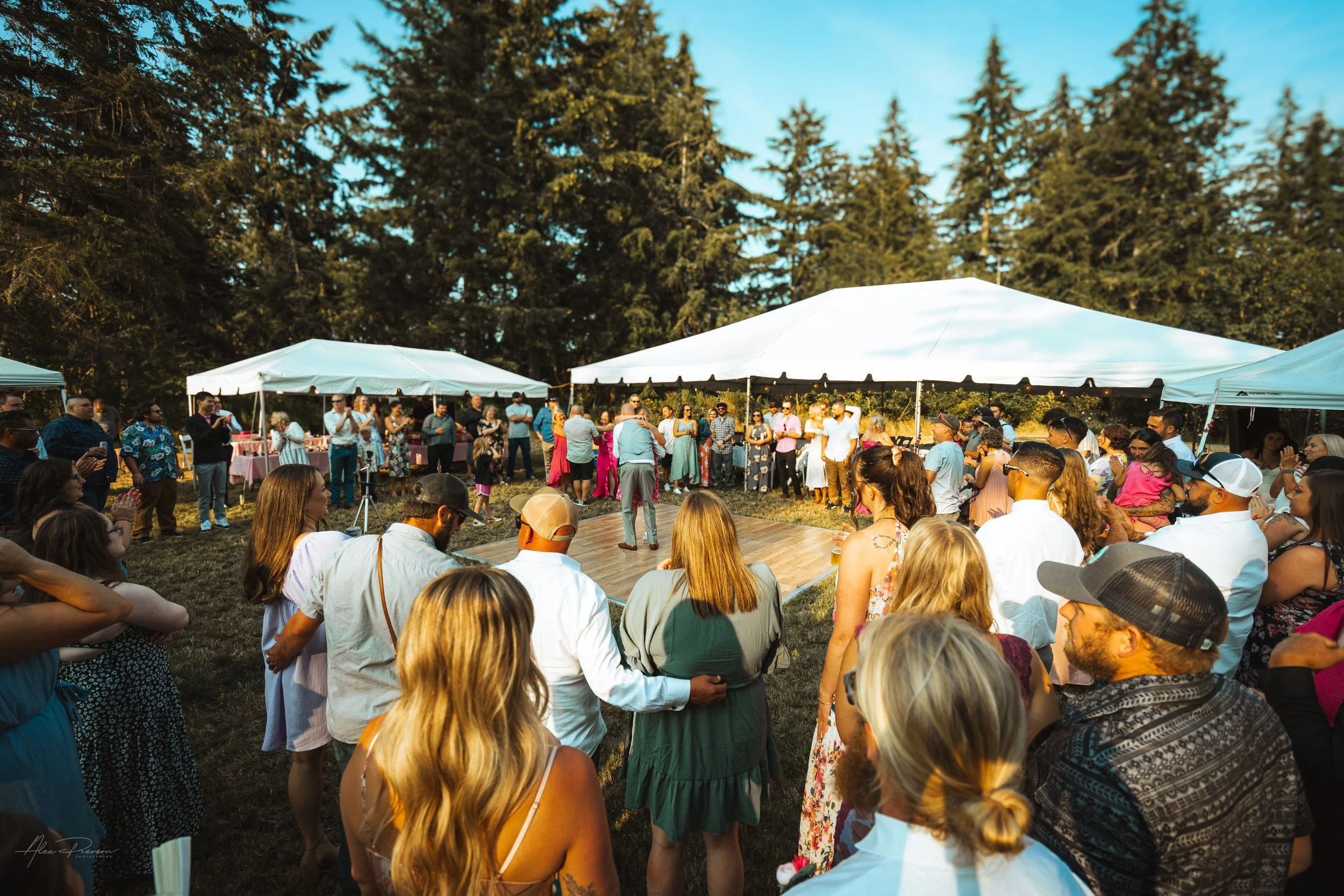 groom dancing with everyone in a circle watching him during his wedding in Olympia, wa
