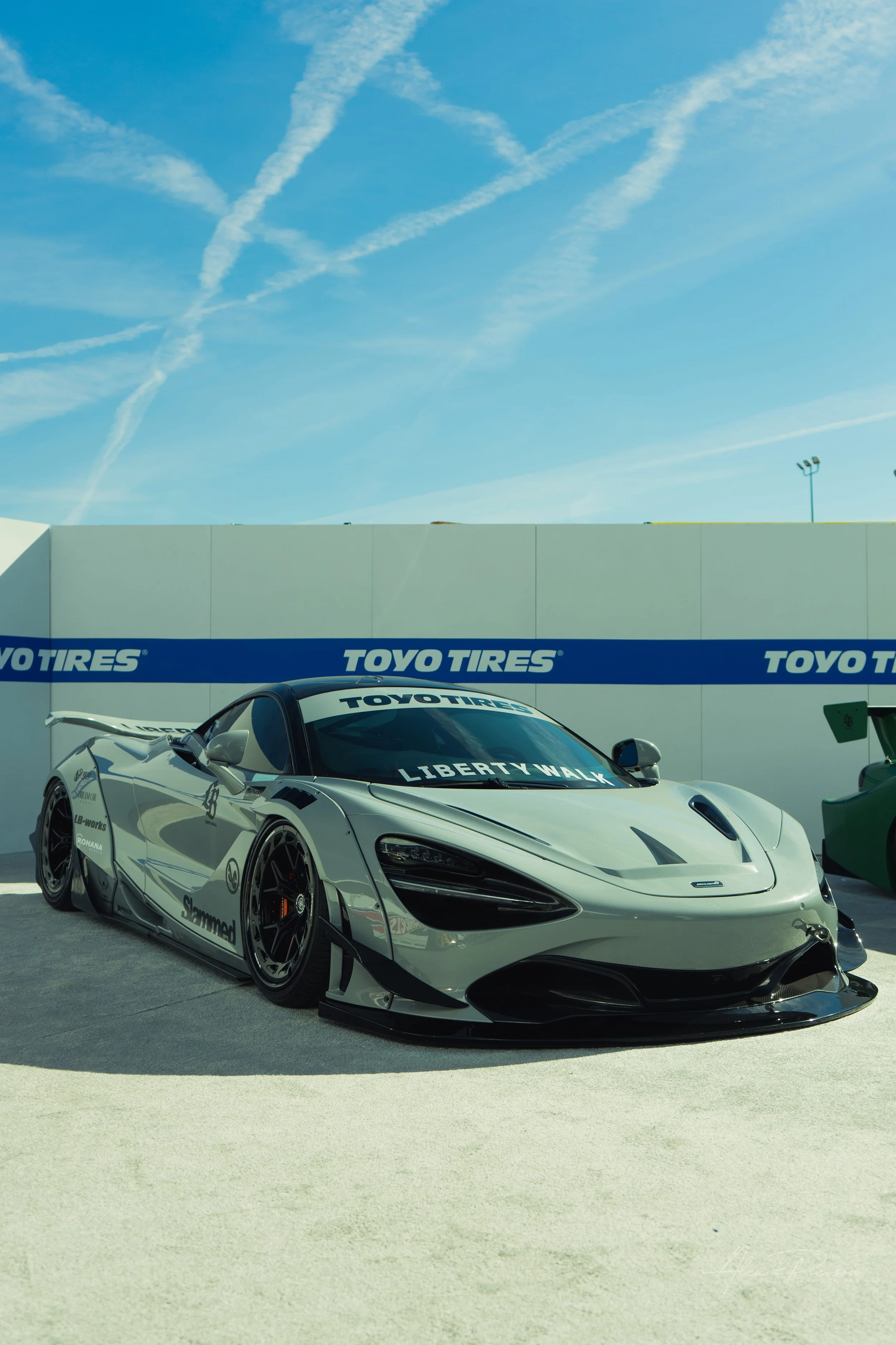 A slammed, nardo grey Liberty Walk McLaren 720S widebody supercar parked at SEMA in Las Vegas.
 Supercar perfection slammed to the ground. This sleek, nardo grey McLaren 720S features a full Liberty Walk widebody kit, sitting perfectly flush on the L