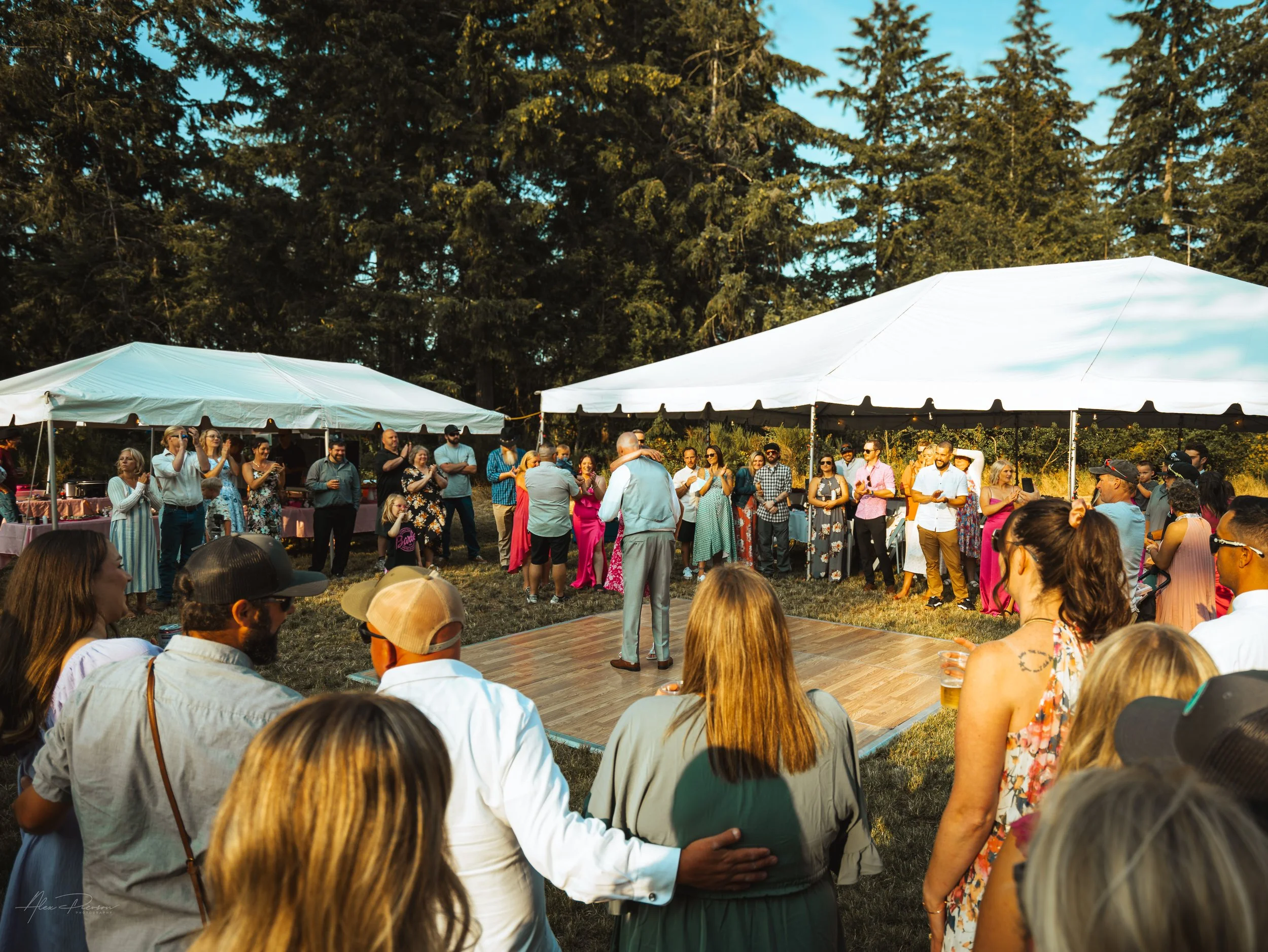 groom dancing with everyone in a circle watching him during his wedding in Olympia, wa