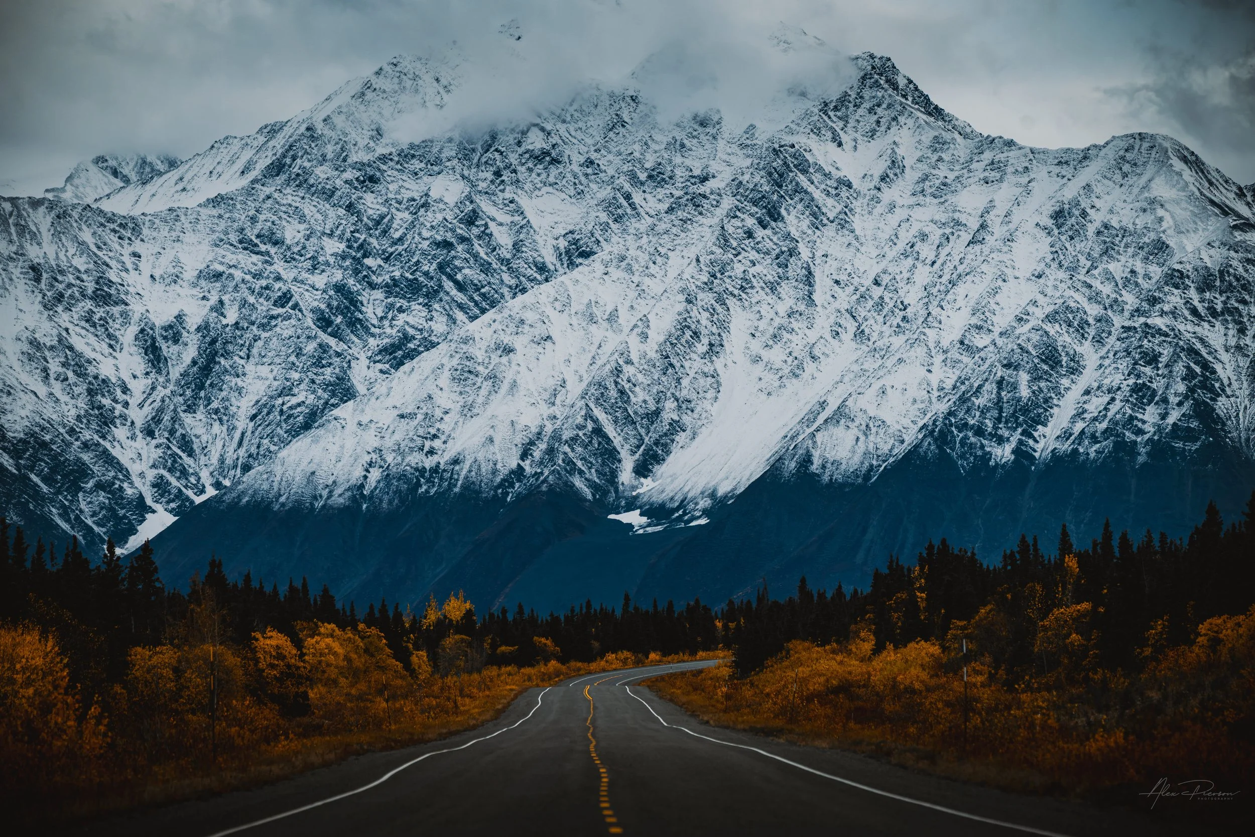 alaska-highway-leading-lines-snowy-mountain-range-landscape-alex-pierson-imges.jpg