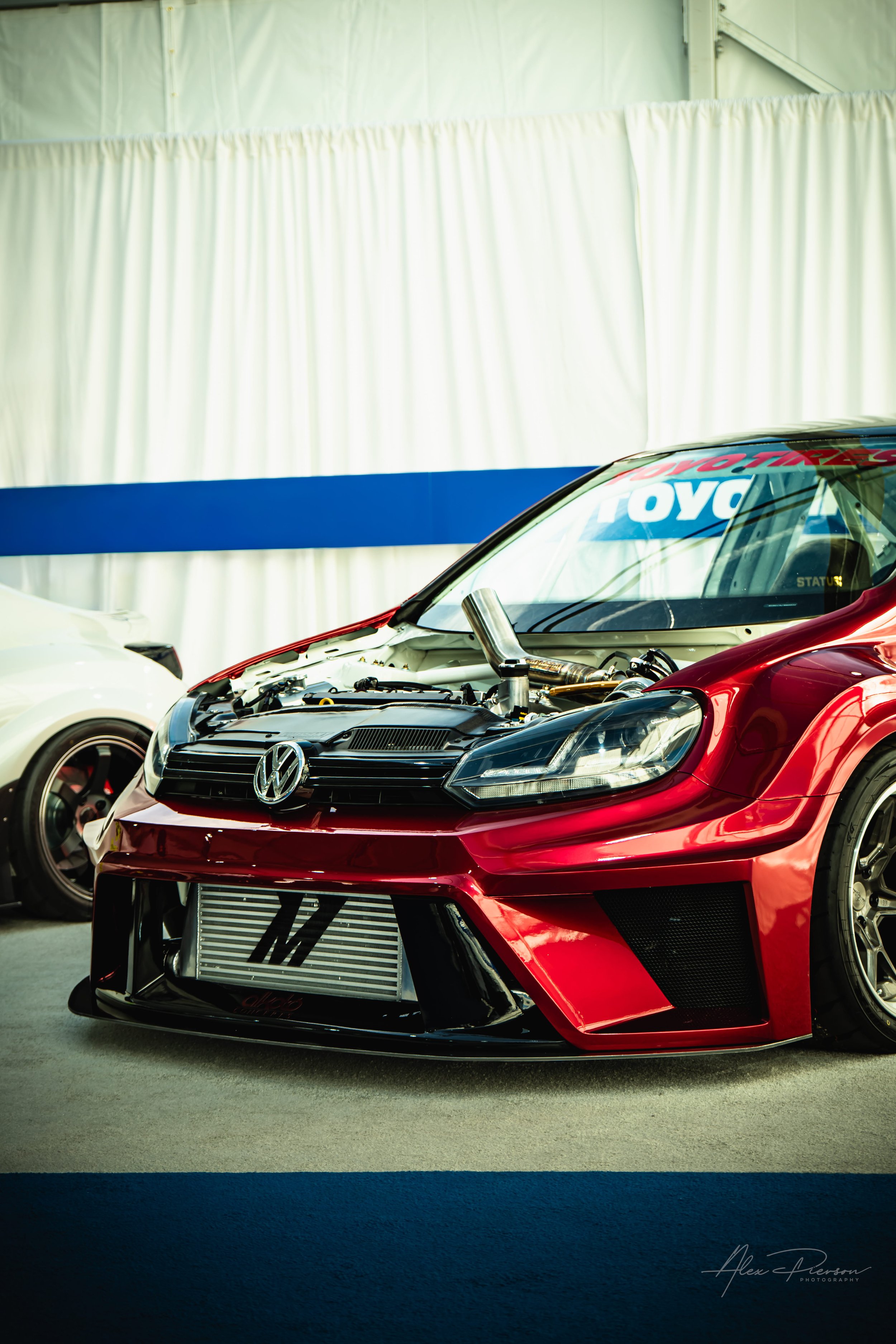 candy-red-vw-golf-gti-hood-exit-exhaust-sema-las-vegas.jpg