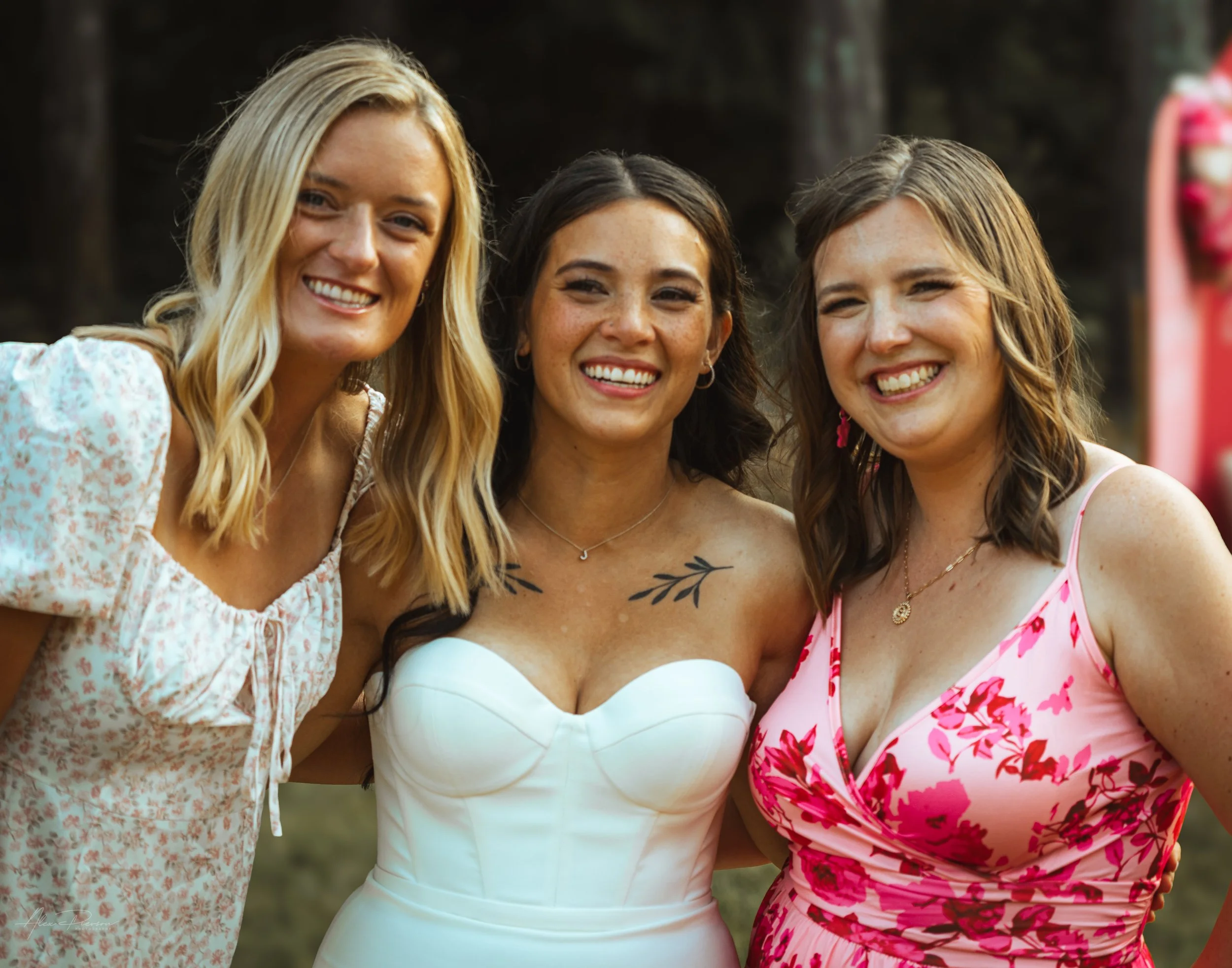bride and bridesmaids posing for a photo during a wedding in Olympia, wa.