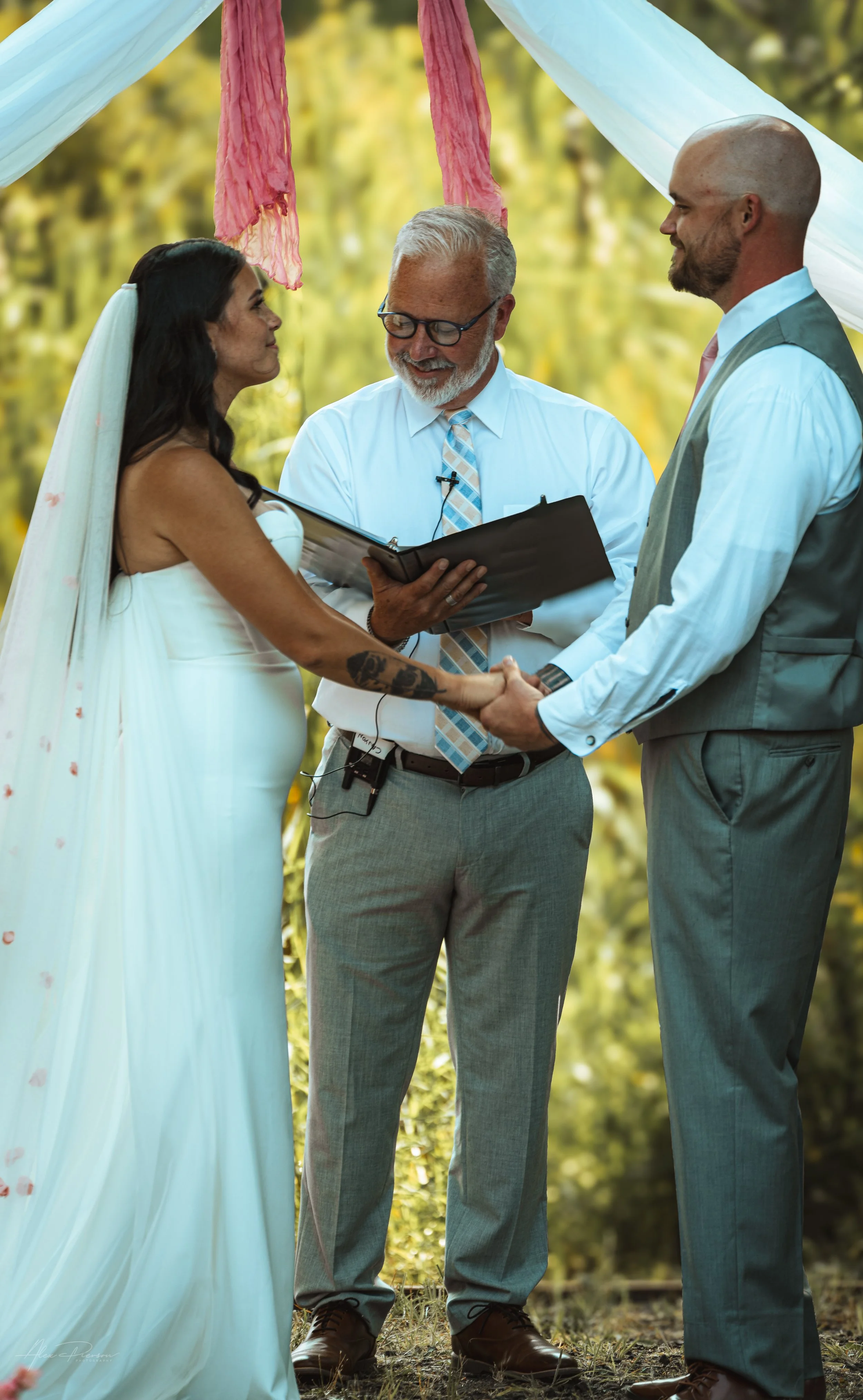 bride and groom saying vows during their wedding in Olympia, WA