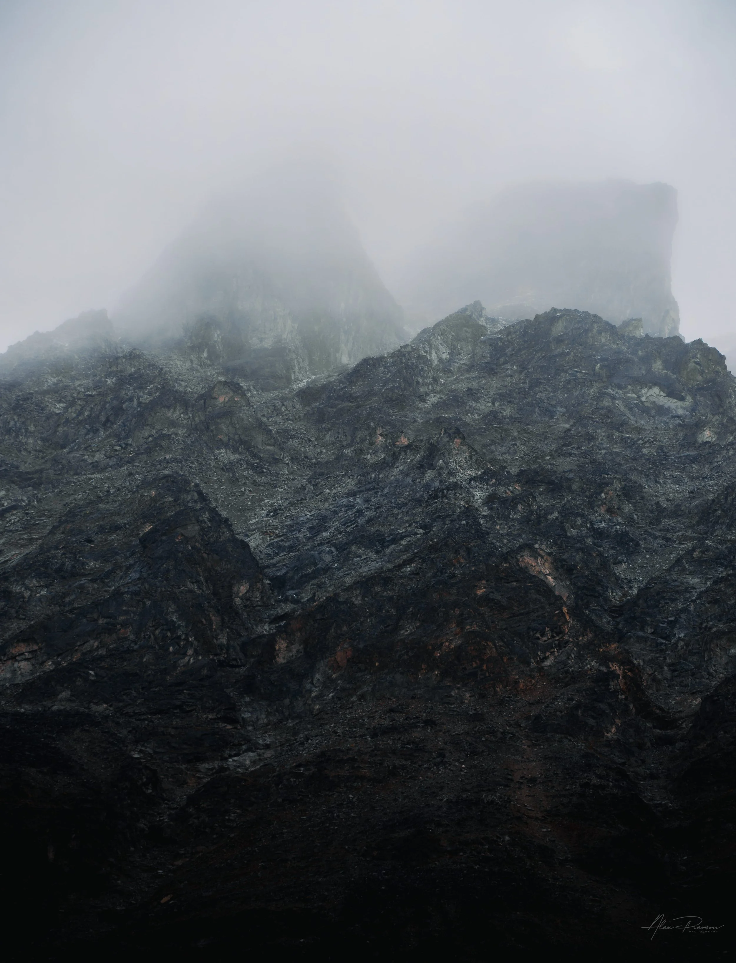 dark-foggy-mountain-peaks-heavy-mist-alaska-landscape.jpg