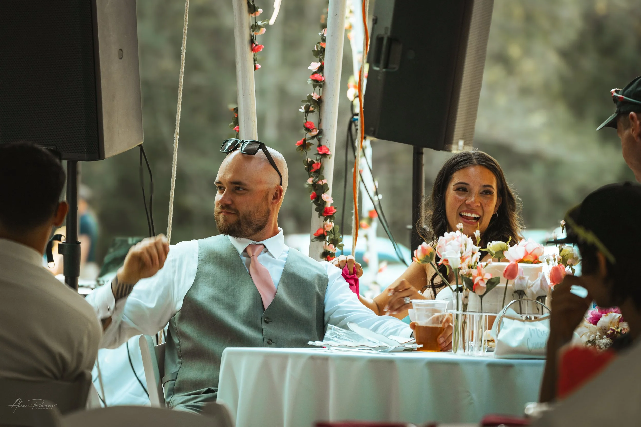 bride and groom laughing together during speeches at their wedding in Olympia, wa