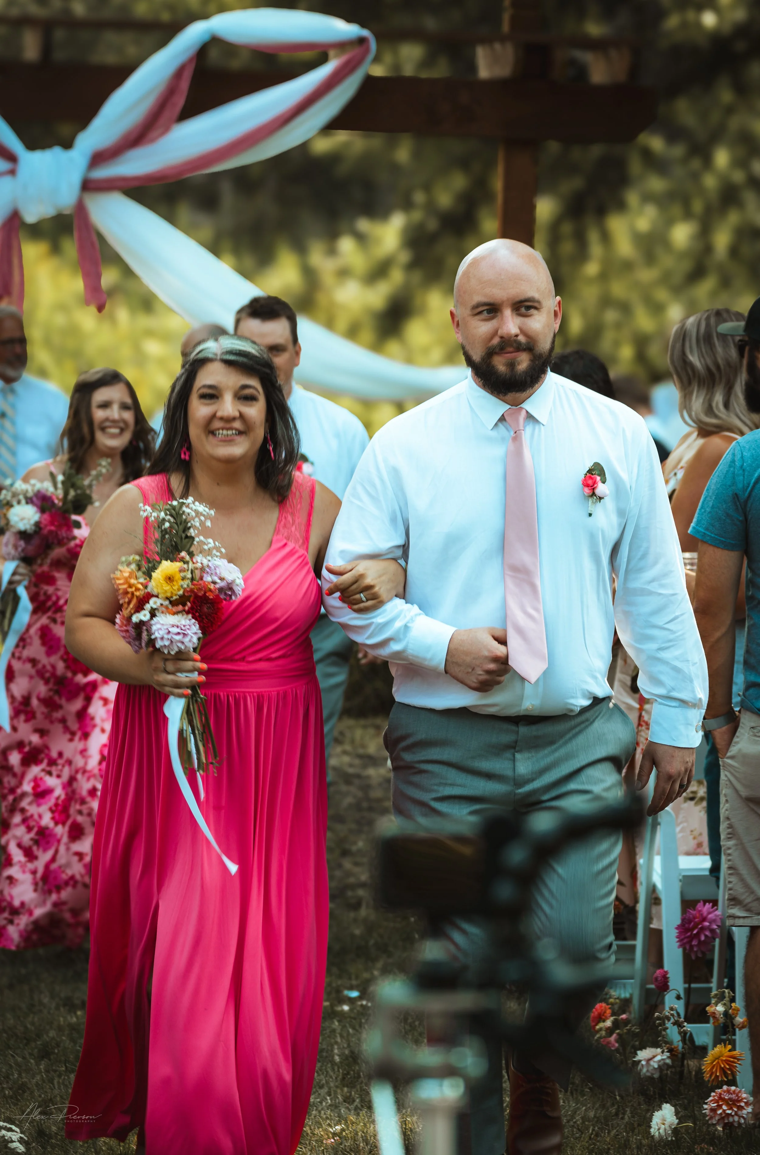 bridesmaid and groomsmen walking down the isle during a wedding in Olympia, WA