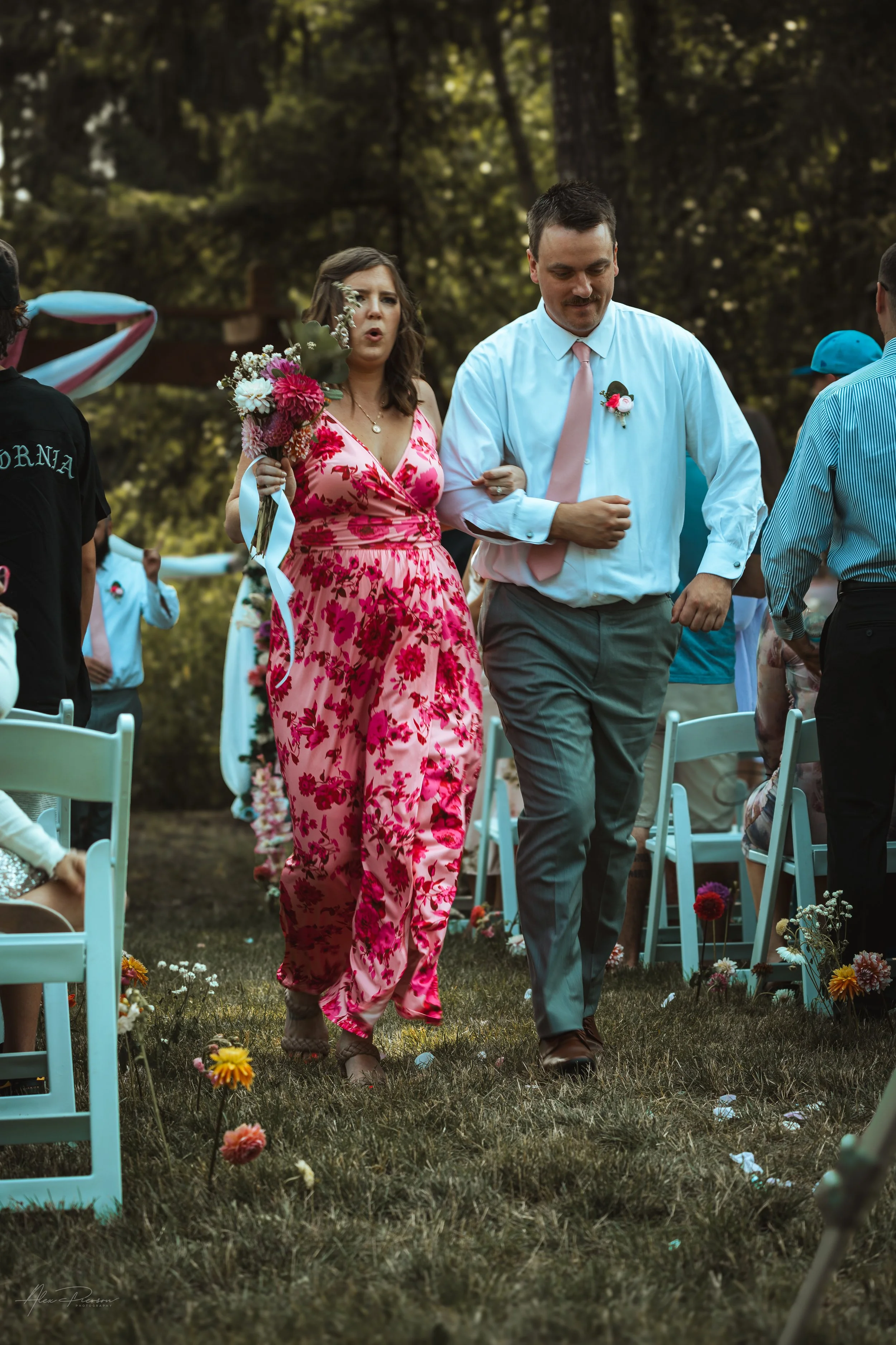 bridesmaid and groomsmen walking down the isle during a wedding in Olympia, WA