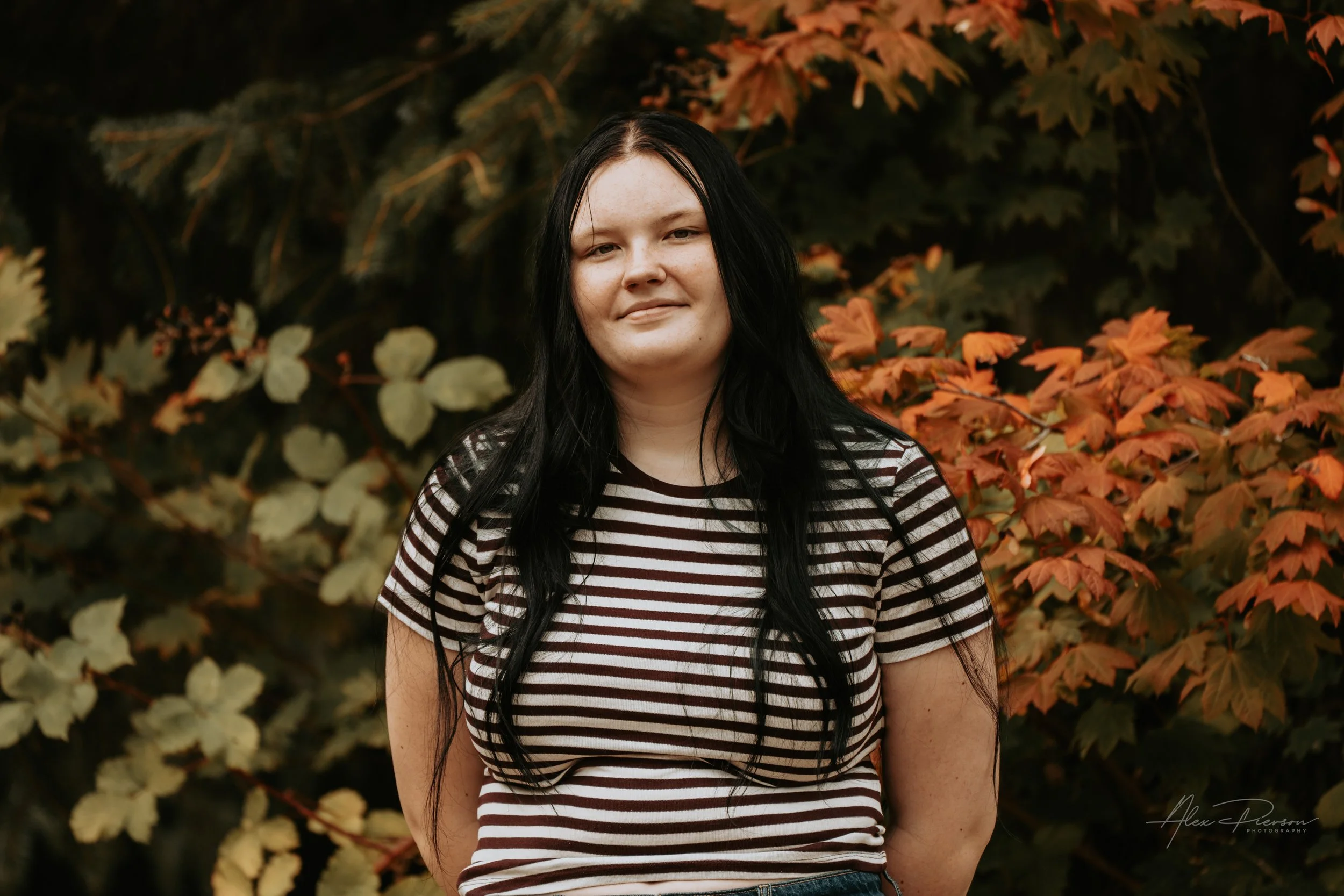 An up close portrait of a young lady wearing a black and white striped shirt during a family photoshoot in Montesano, WA- – Pacific Northwest lifestyle family and children's photography.